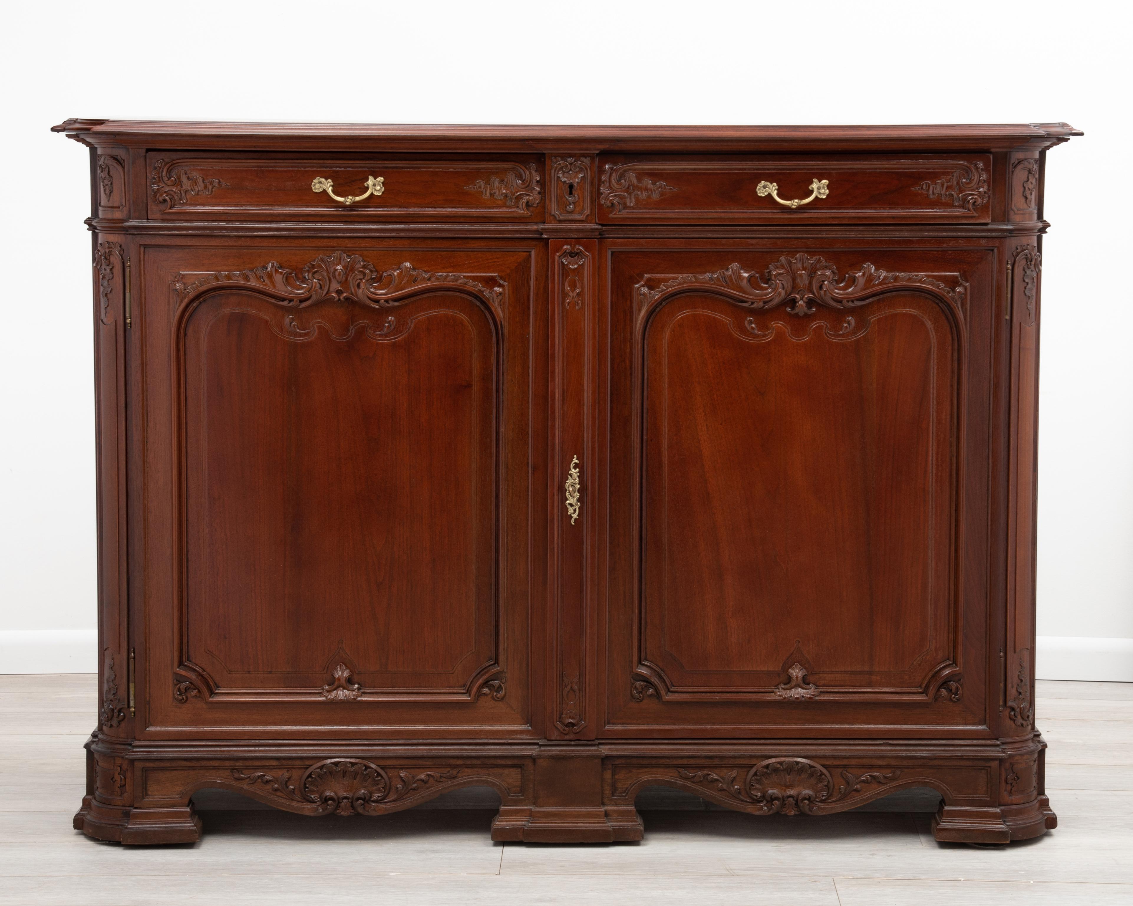 An impressive French Provincial walnut sideboard or buffet with two drawers over two paneled doors. Great wood selection, beautifully restored.