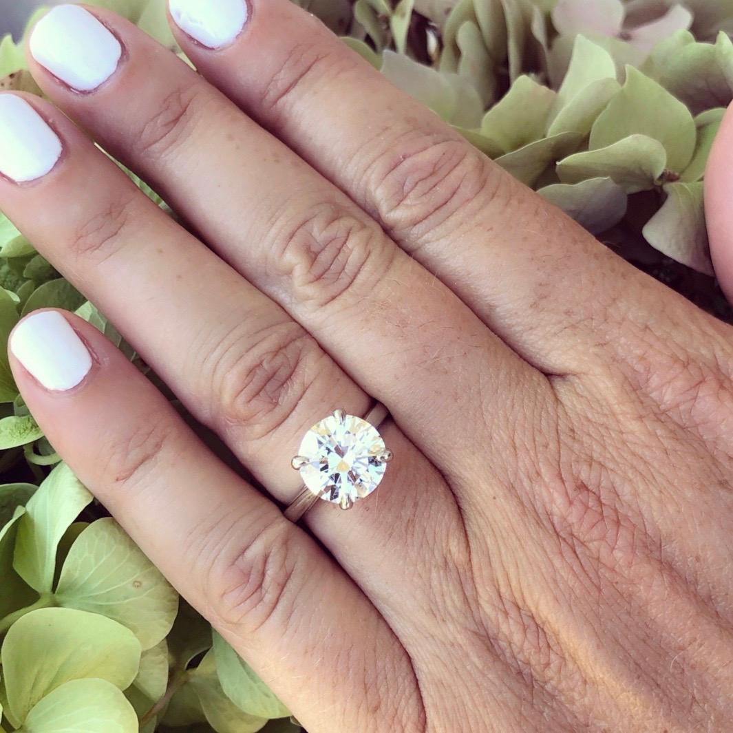 Not all diamonds are equal! Big and bold, this 4.07-cts round brilliant-cut diamond, H color and SI1 clarity, is a showstopper. Set in a platinum 4-prong mount with an open V basket, the simplicity of the setting highlights the magnificence of the