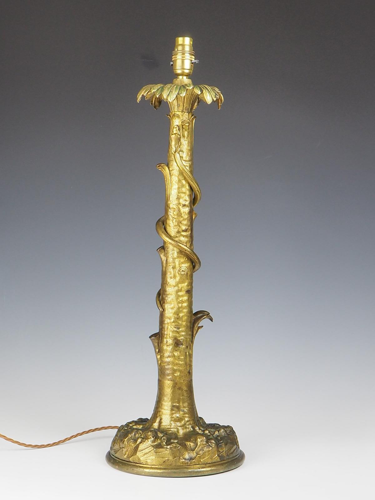 Impressive Gilt Laquared Tree Table Lamp is a truly remarkable piece that effortlessly combines elegance with a nature-inspired design. This lamp is not only a functional lighting fixture but also a stunning decorative item that will elevate the