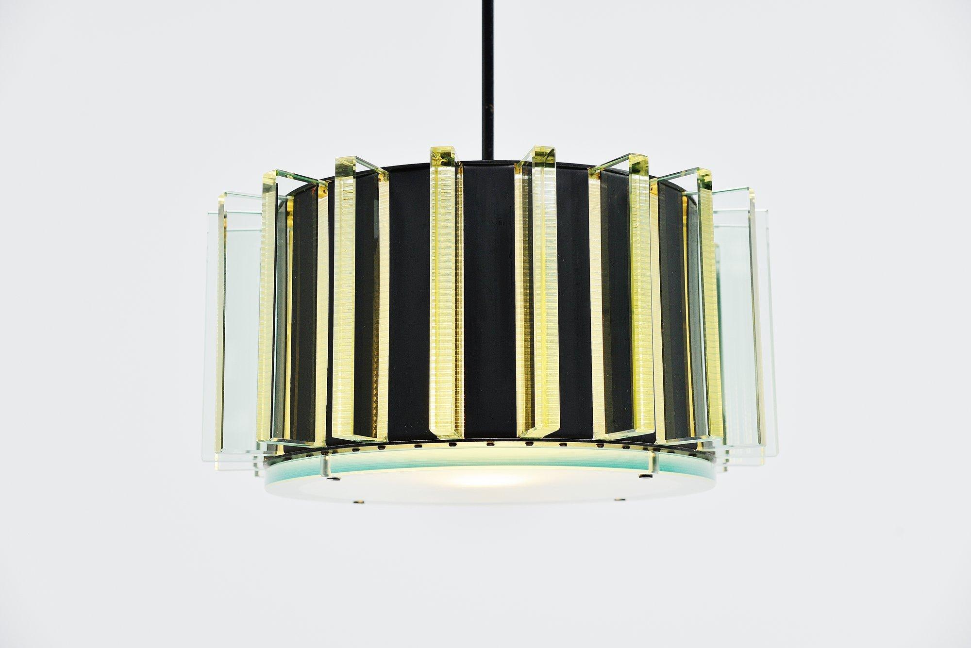 Very nice and spectacular chandelier made by unknown designer or manufacturer, could be early Stilnovo. In the manner of Fontana Arte, Max Ingrand and Pietro Chiesa. The frame is made of black painted aluminium and brass. The lamp is completely