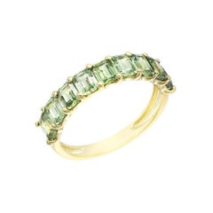 Impressionnante bague en or jaune avec saphir vert et diamant