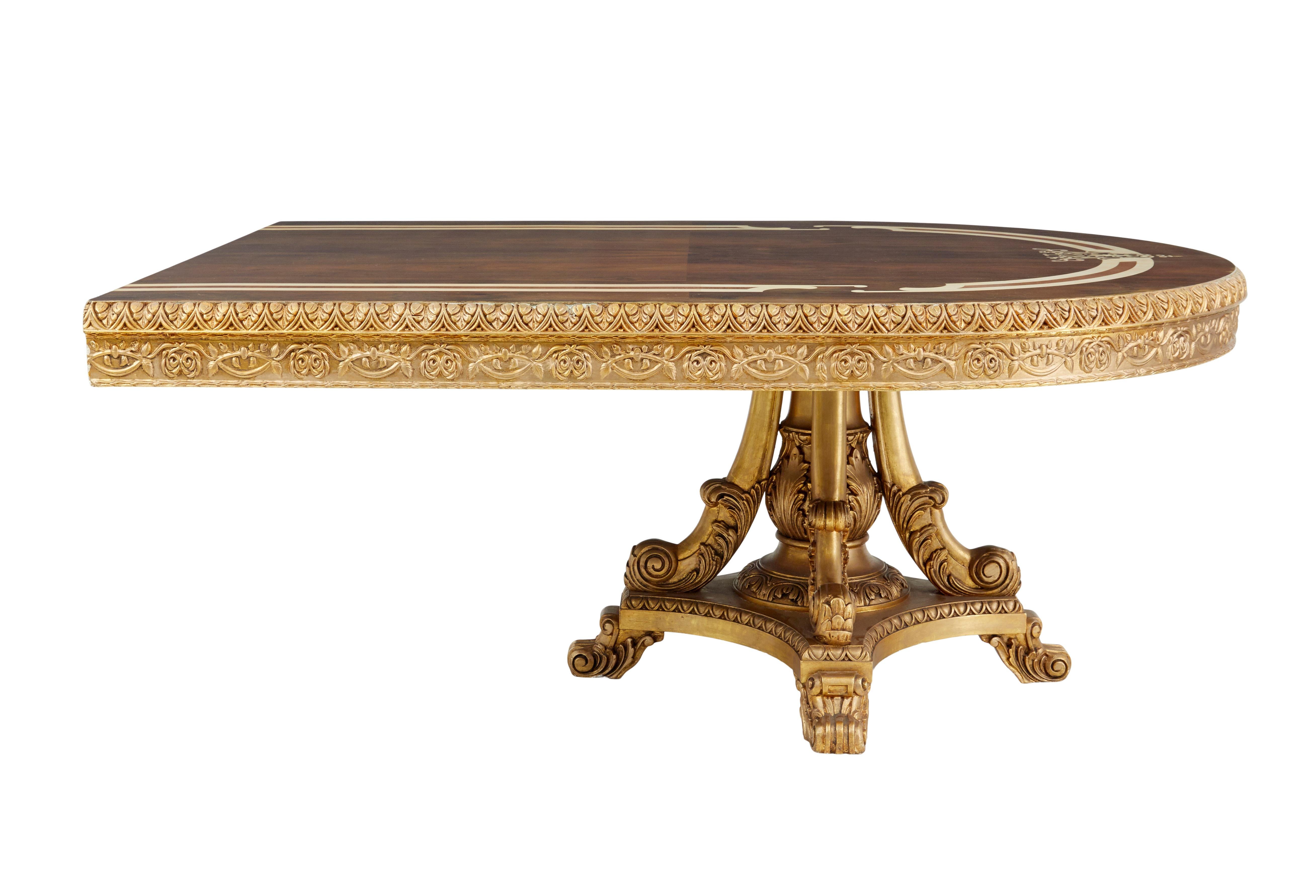 Impressive inlaid walnut and gilt dining tables of grand proportions.

We are pleased to offer this table of magnificent proportions, which could function as a entrance/lobby center piece or a dining table.  We believe this table was made as a one