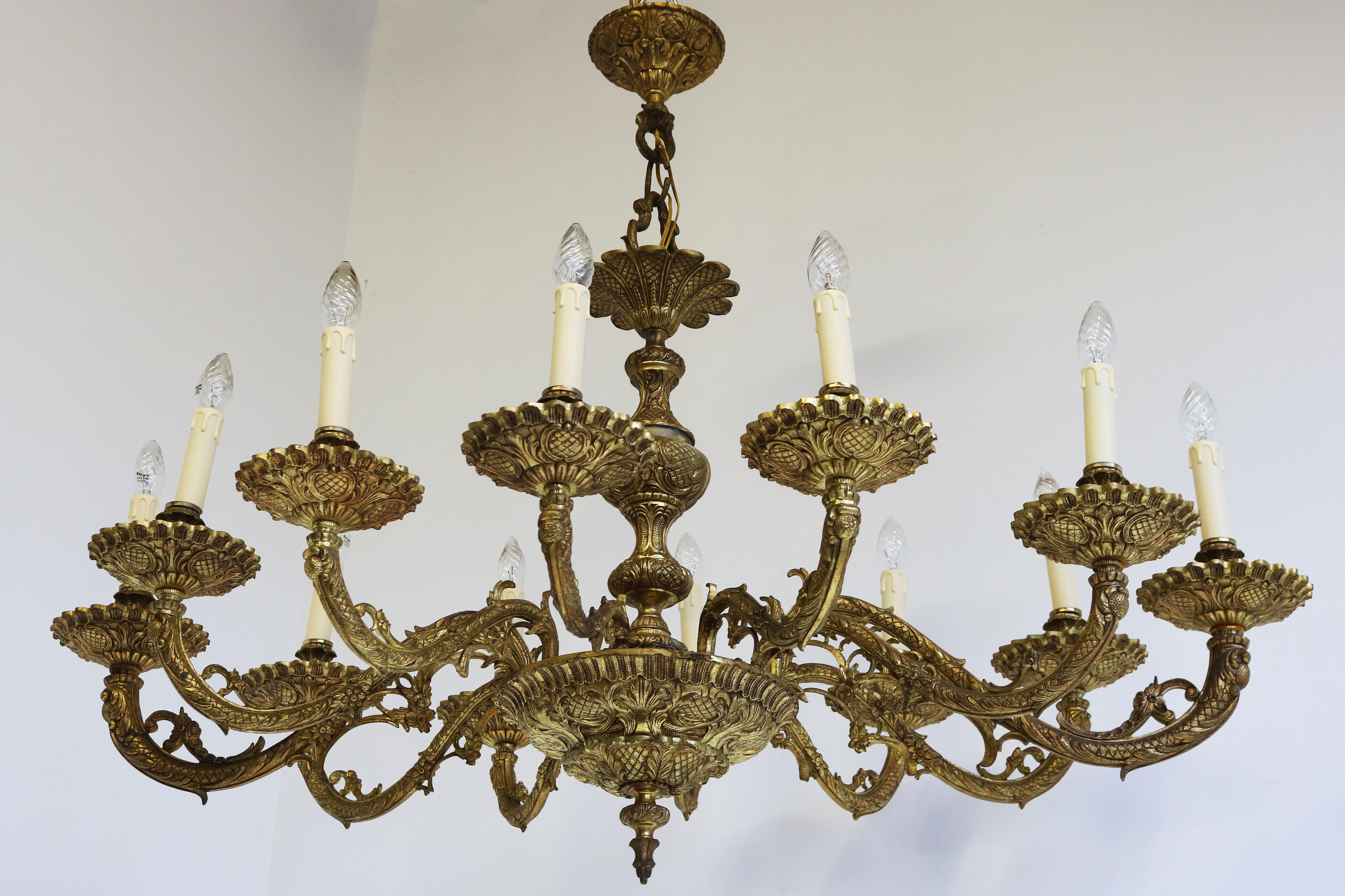 Impressive & luxurious ! This solid brass rare Oval chandelier Antique from the 1920s in classical style from Italy. 
This impressive highly decorated model is very rare due to its oval design , which maks it perfect for use above a dining