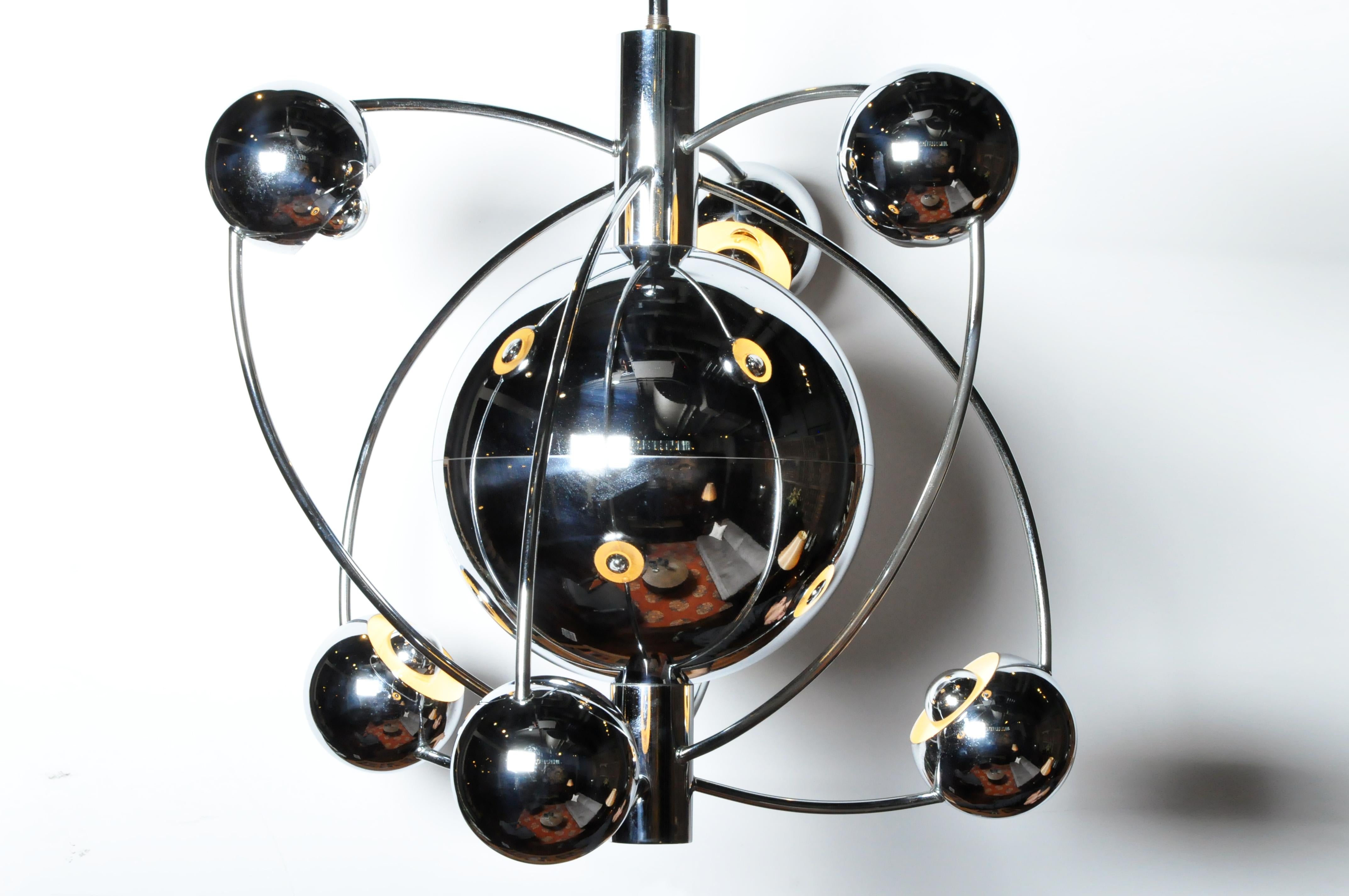 This gorgeous Mid-Century Modern chandelier is from Italy and was made from chrome, circa 1970. The piece has been rewired for use in the U.S. Wear is consistent with age and use.