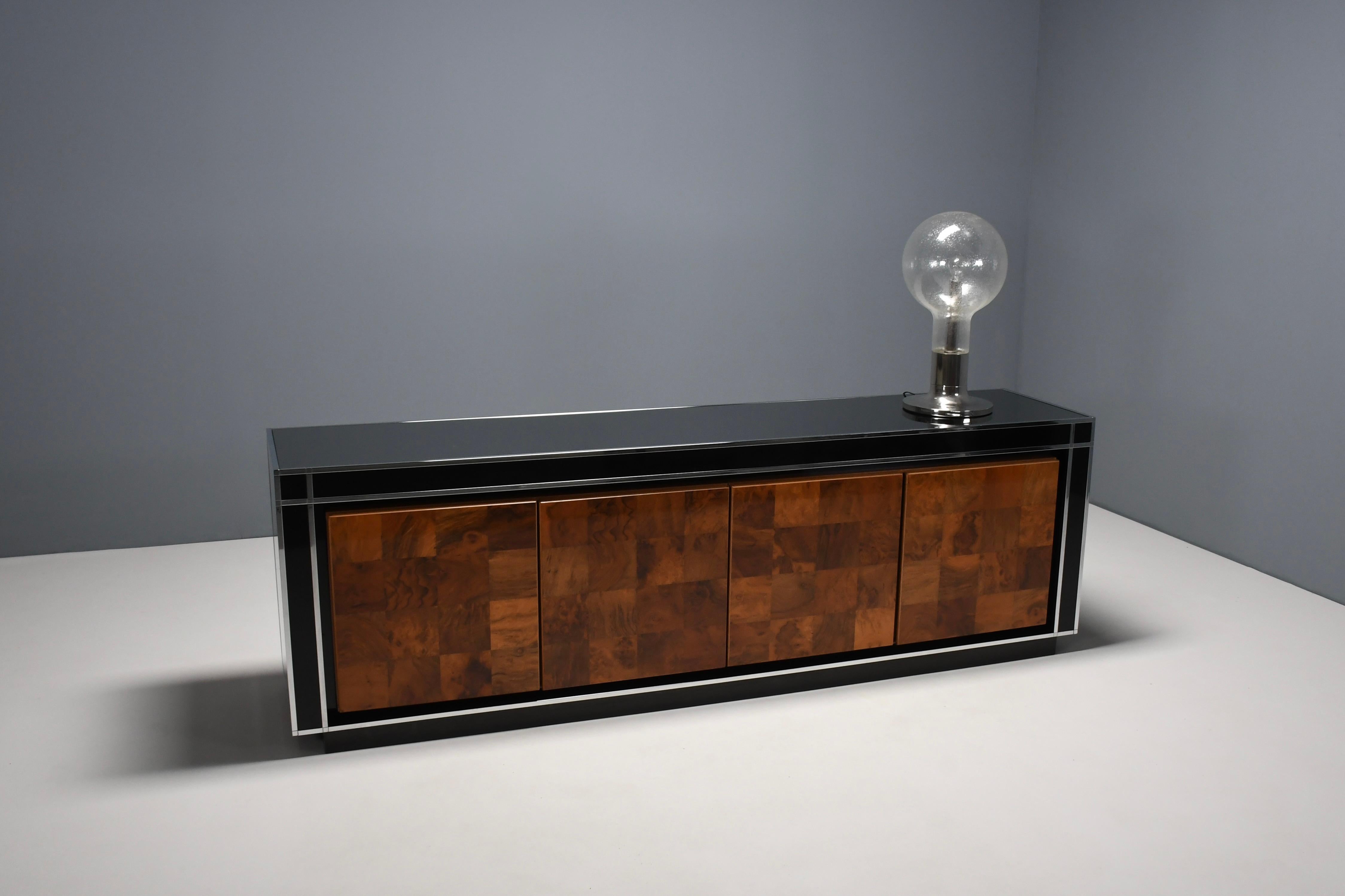Italian Sideboard by Willy Rizzo for Mario Sabot, 1970s

Beautiful large sideboard in very good condition.

Designed by Willy Rizzo 

Produced by Mario Sabot, Italy 1970s 

This sideboard is finished in a glossy black veneer with chrome metal