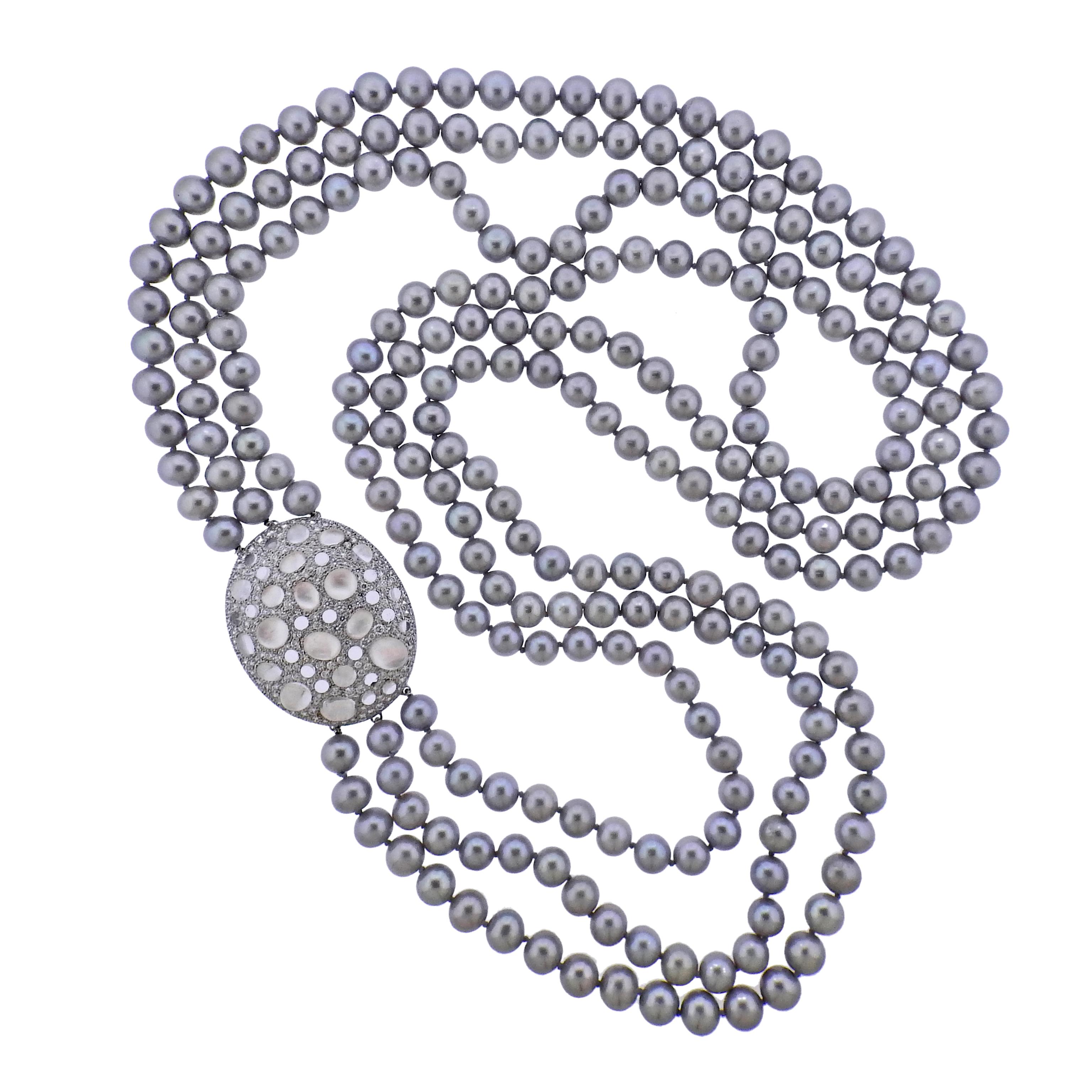 Long three strand grey pearl necklace, crafted by Ivanka Trump, featuring oval 35mm x 45mm 18k white gold clasp, set with approximately 4.65ctw in VS/G diamonds and crystals. Necklace set with 8mm - 8.7m grey pearls. Clasp does not open or close,