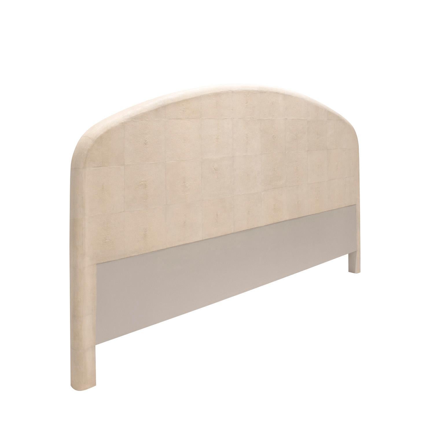 Stunning king size headboard in ivory shagreen, custom design, American 1980's. This headboard is beautifully crafted in the finest materials with meticulous attention to detail. There is a cleat on the back in case you want to affix it to the