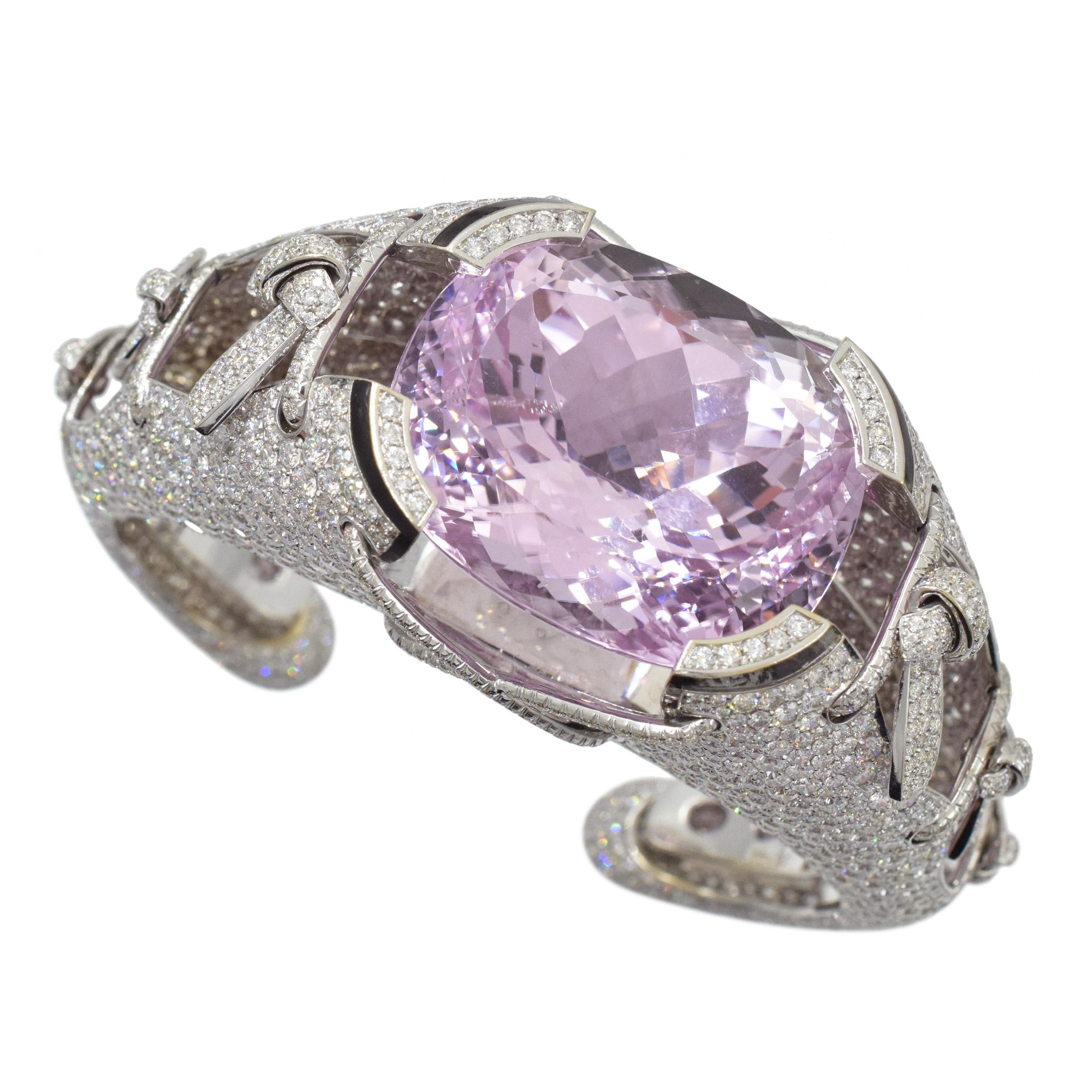 Impressive Kunzite and diamond and enamel cuff bracelet in 18k white gold. Center of this bracelet set with cushion shaped kunzite measuring approximately 27.5mm by 32.2mm (approx. 160 carats). 
The bracelet is fully encrusted with round brilliant