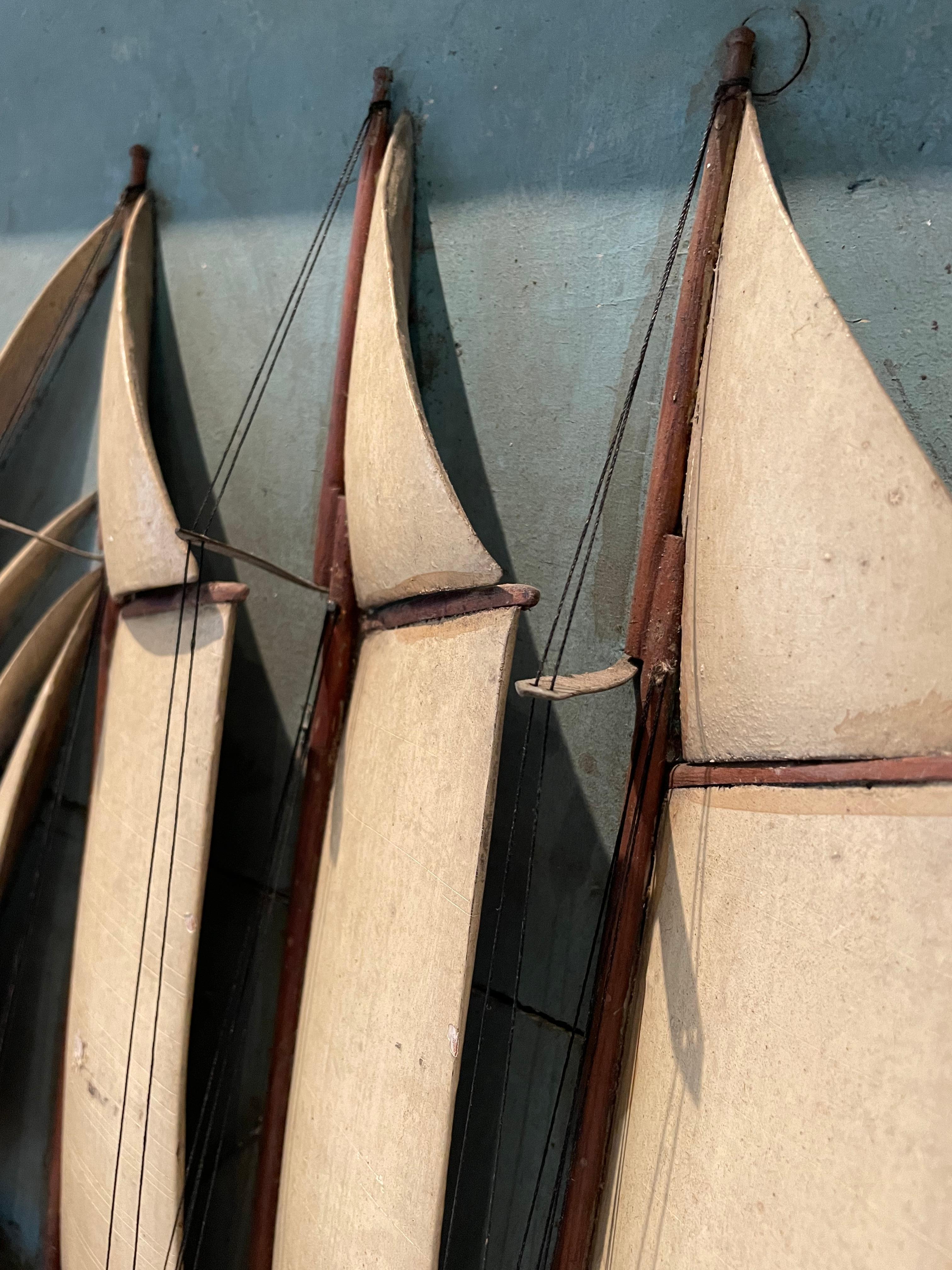 An impressive 19th century painted and carved wood diorama of a 5 masted schooner ship in relief having twine lines and wonderful light blue and cream color palette. There was never glass covering the diorama, as there's no ridge where glass would