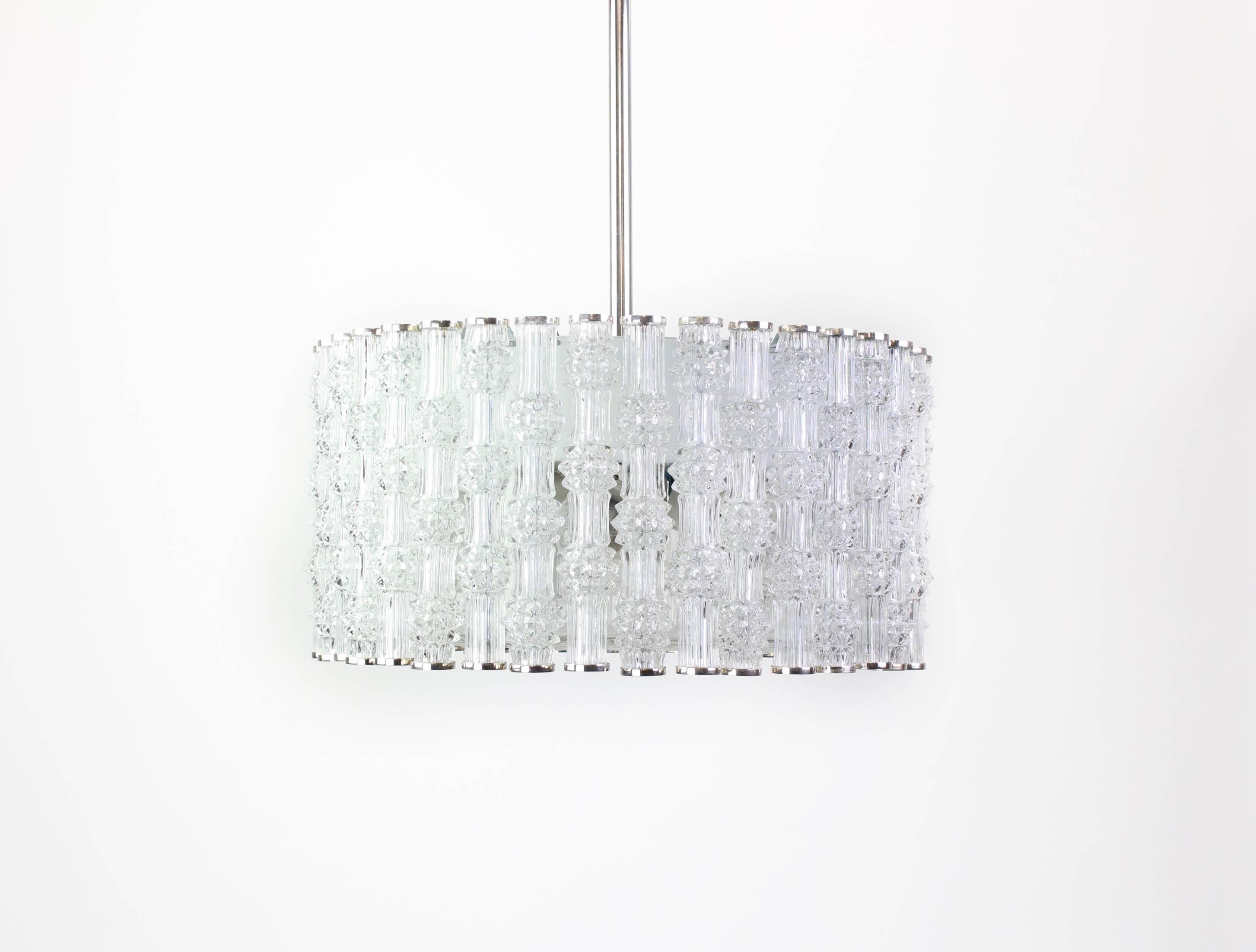 Chrome drum form pendant ceiling fixture with tubular textured glass shades by Kaiser Leuchten, Germany, circa in the 1960s.

High quality and in very good condition. Cleaned, well-wired and ready to use. 

The fixture requires 6 x E27 Standard