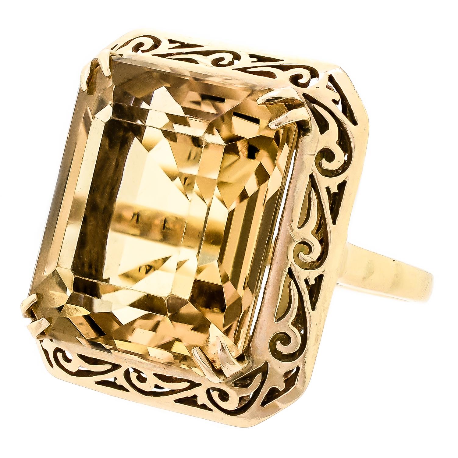 An elaborately designed 14 karat yellow gold mount is the home to one impressive golden yellow square step-cut citrine that glistens and glows from within. Handsomely tailored this big, and bold citrine and yellow gold ring exude luster with one