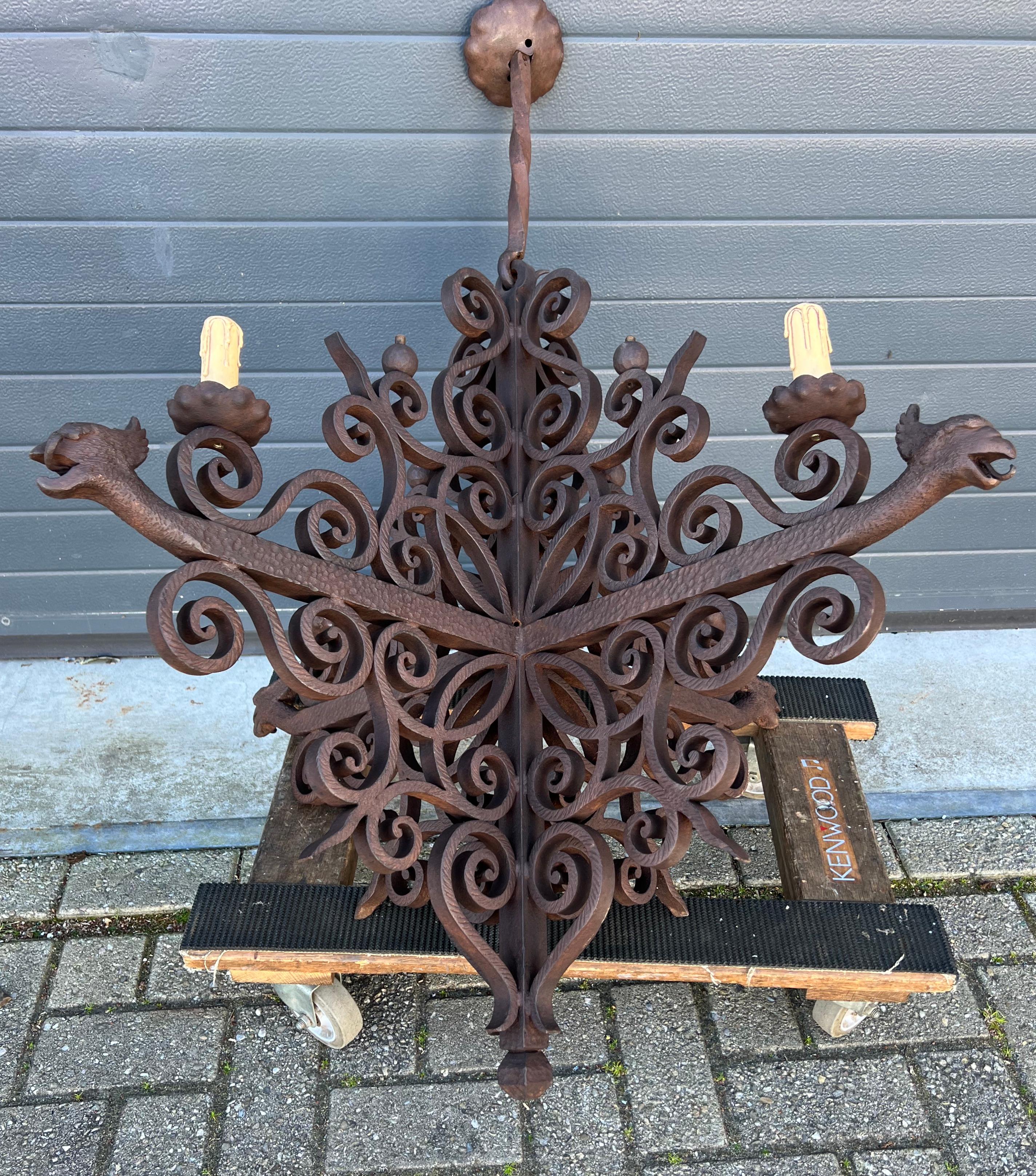 Amazing and skillfully hand-crafted, Gothic art wrought iron pendant.

This artistically designed and outstandingly executed, thick wrought iron chandelier is in excellent condition and it comes with stunning and mint phoenix sculptures. Over the