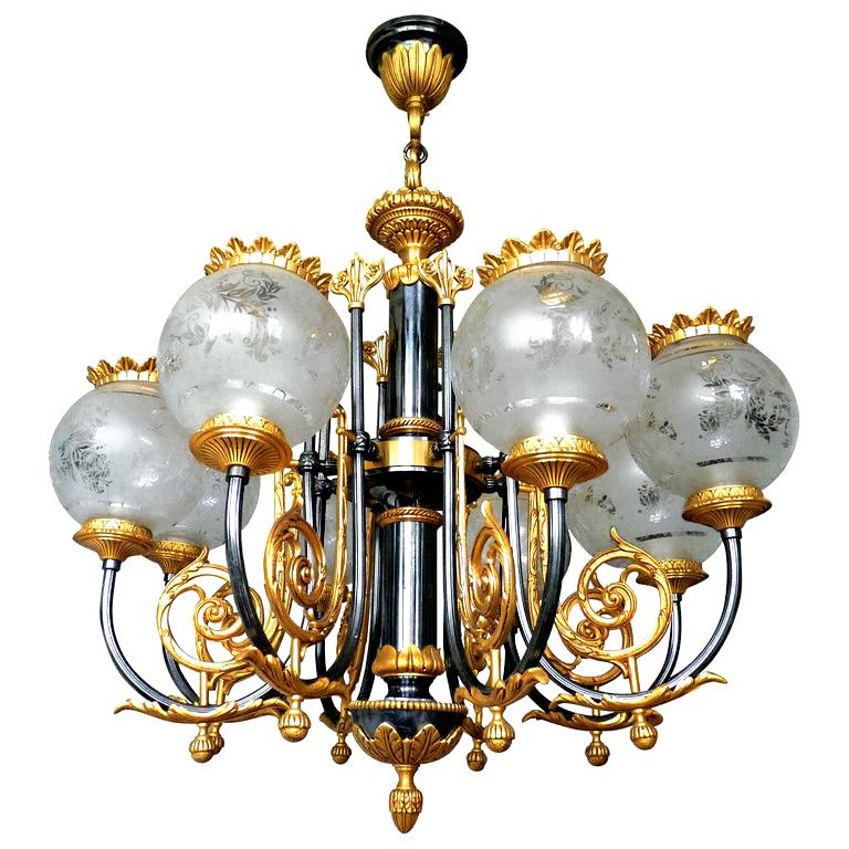 Spectacular neoclassical French Empire gilt bronze 8-light chandelier, oxidized an gold-plated solid bronze
8-light bulbs E 14/good working condition
Measures:
Diameter 27.6 in/ 70 cm
Height 33.5 in/ 85 cm
Weight 36 lb. (16 kg).
Glass shades, 6 in