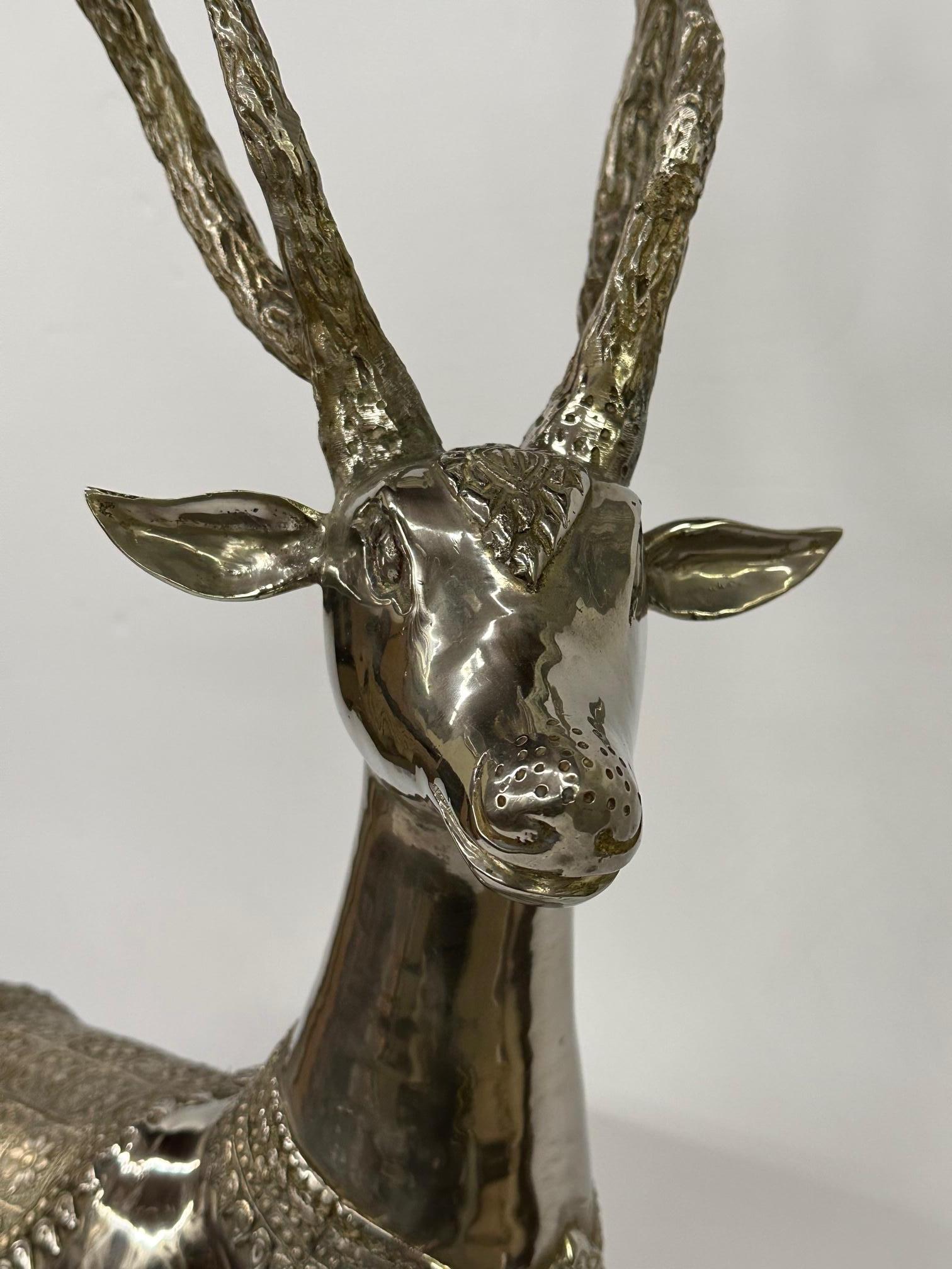 Meticulously detailed large and impressive nickel plated brass standing deer sculpture.
