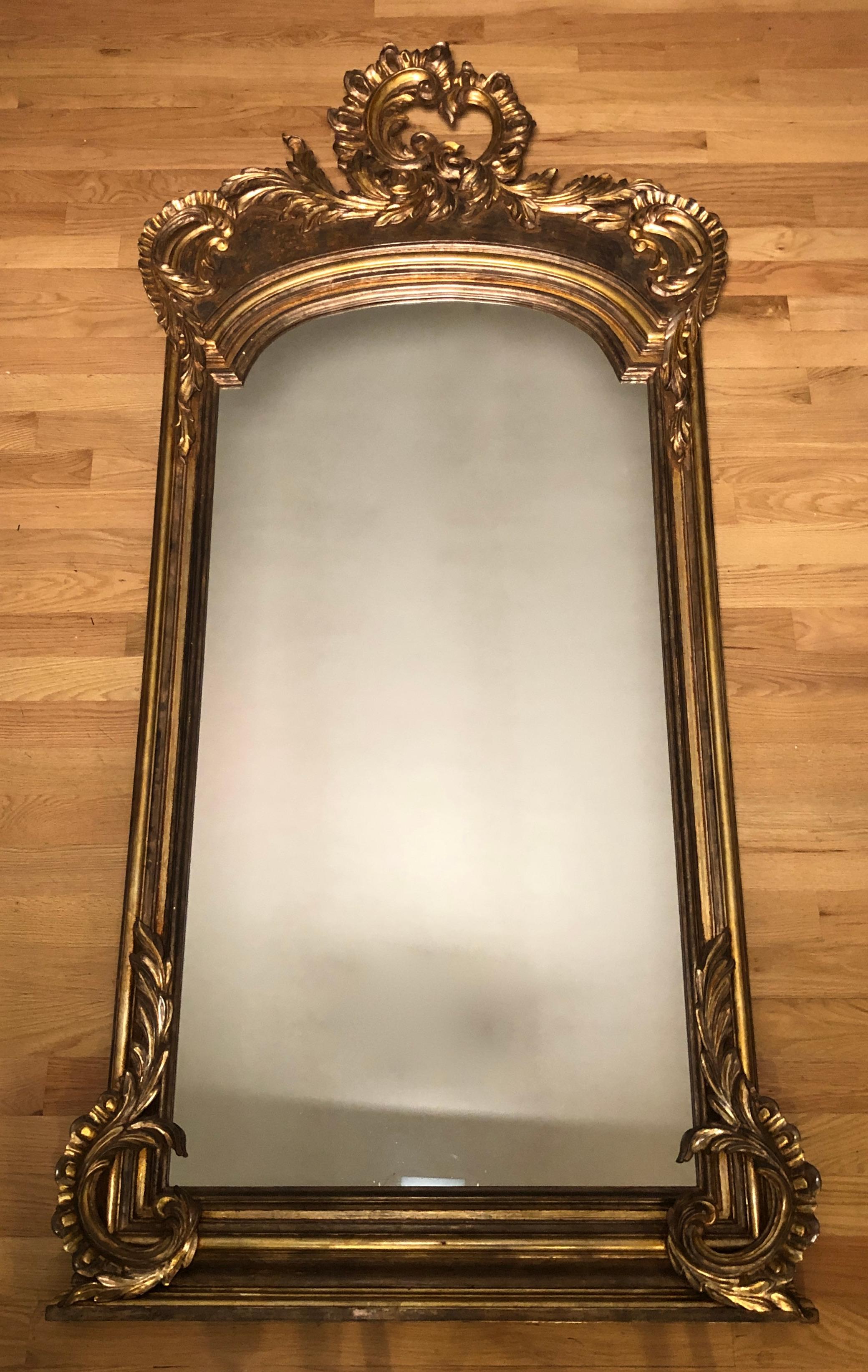 Large and Impressive Louis XV mirror. Painted and gilt mirror of large scale with areas of silver gilding.
