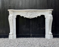 Impressive Louis XV style mantel in finely carved Carrara marble, circa 1880