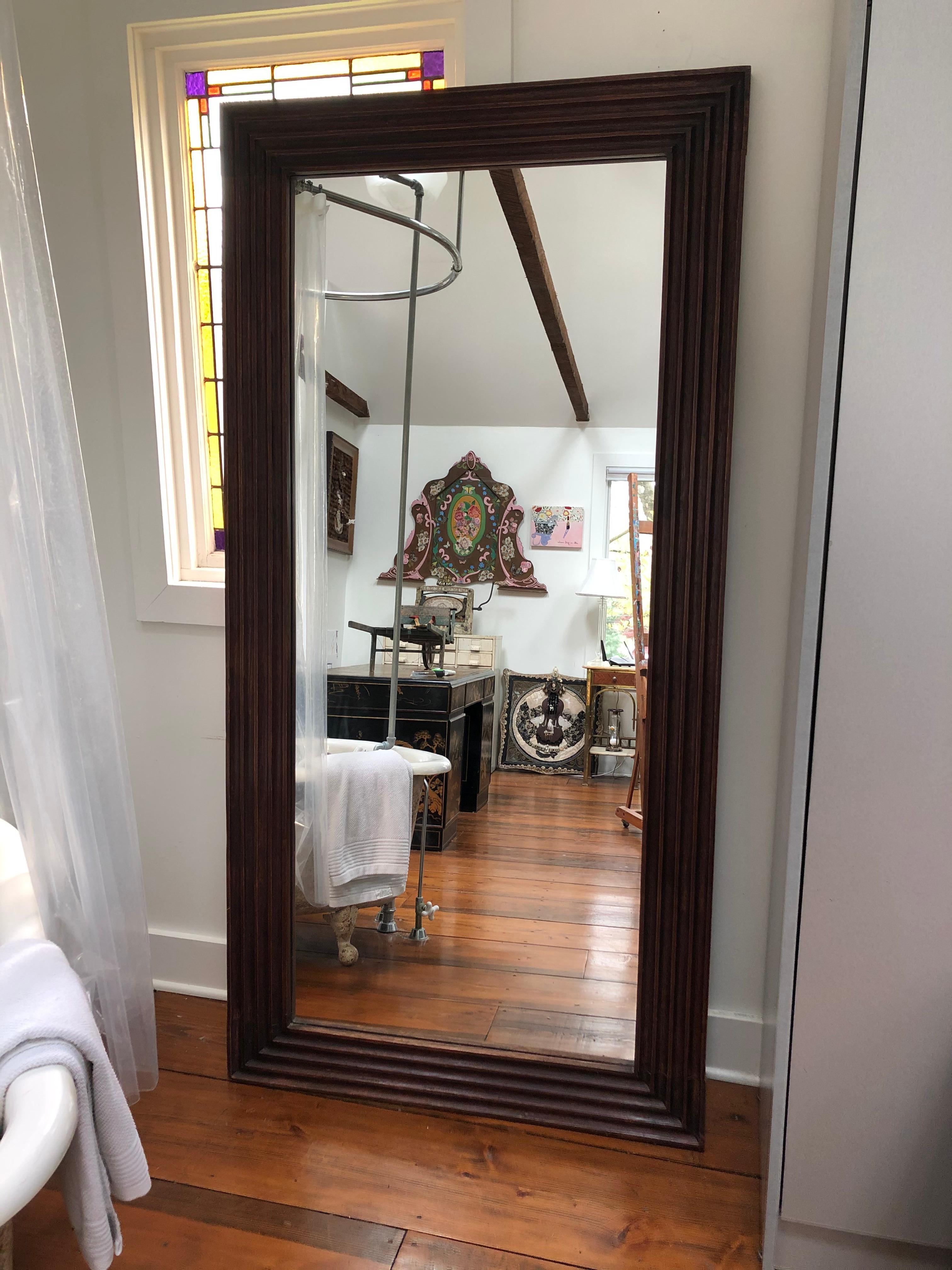 Supersized very handsome carved walnut rectangular mirror. Can be hung vertically or horizontally, or is great standing against a wall or corner for a full length view.