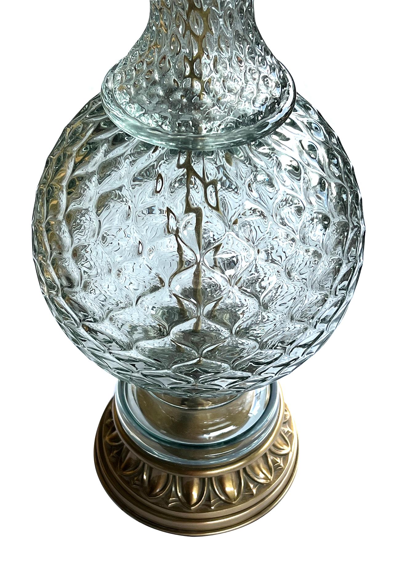 the large and heavy hand-blown baluster-form lamp with textured surface; the waisted neck collar above a spheroid body; all resting on an egg-and-dart brass base; manufactured in Italy for the Marbro lighting company