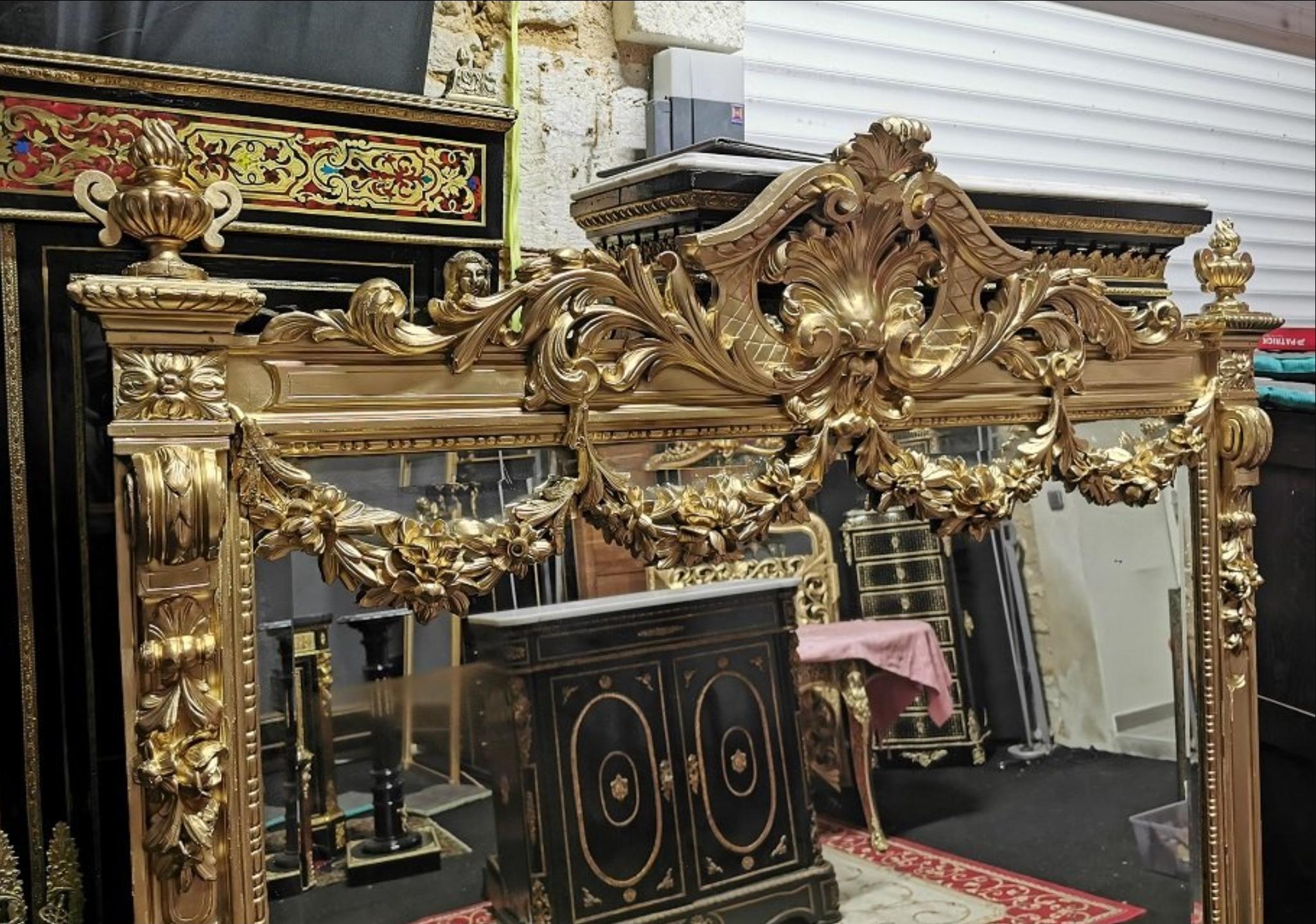 Impressive large dimension Napoleon III mirror, in giltwood and gilt stucco, beautiful details with richly decorations with leaves garlands, scrolls, ribbons and scraps. Gorgeous and Rare shape.
France, 19th century, circa 1865, in a very good