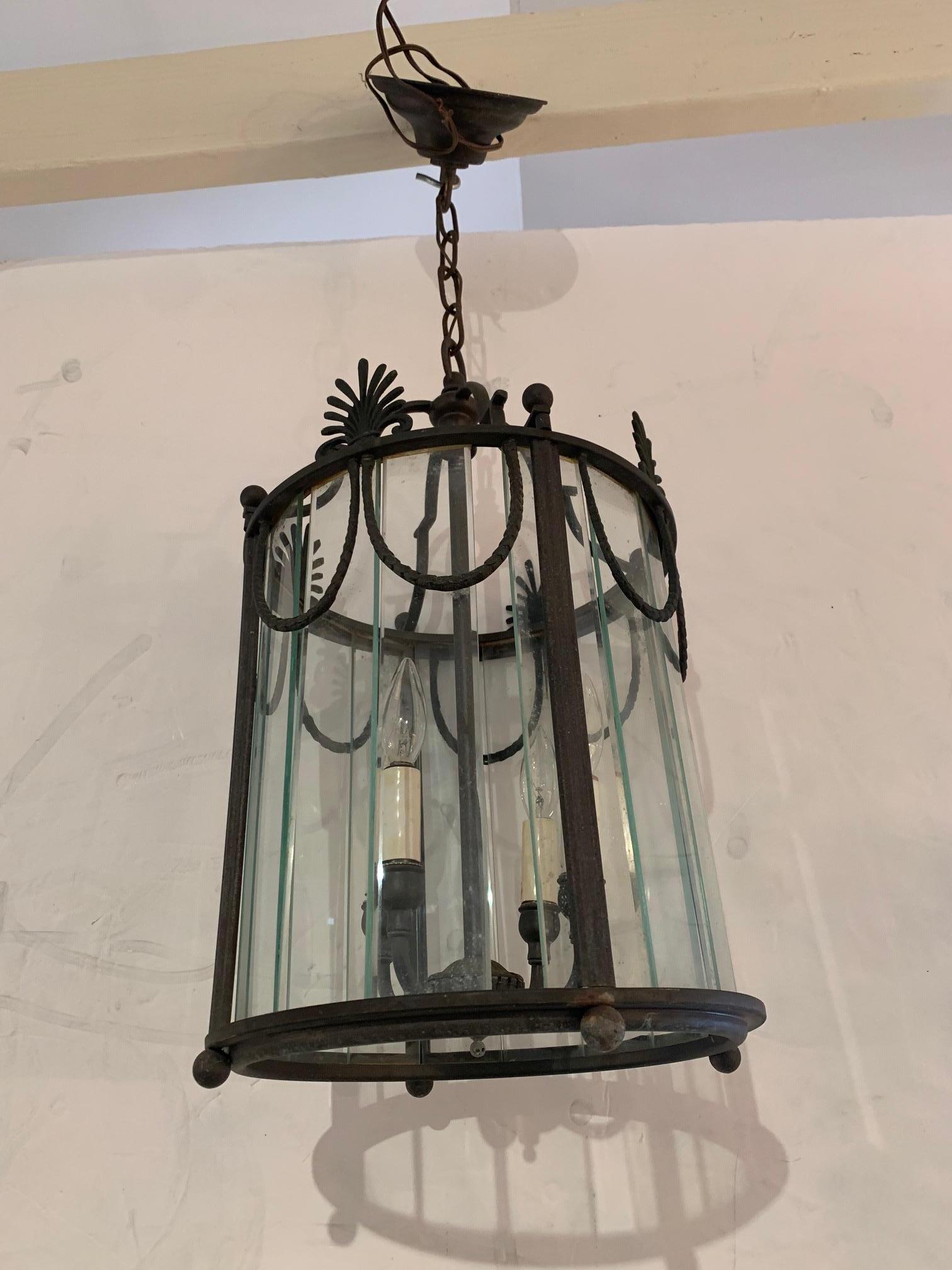 Beautiful vintage neoclassical style lantern of patinated bronze and paneled glass having 8