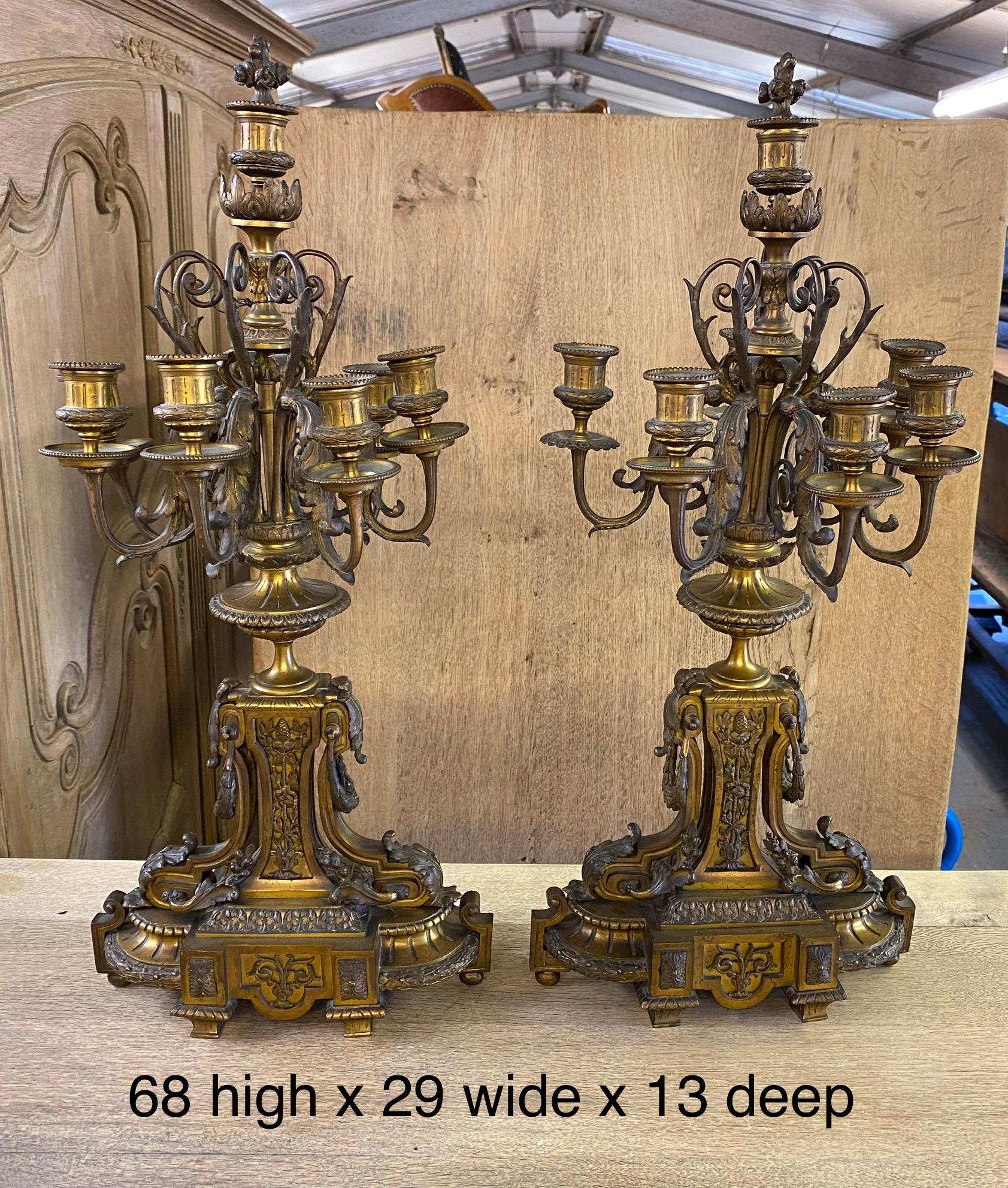 A fine quality large pair of gilt bronze candelabra dating to the 19th century. Each has 6 branches and a top central candleholder. They would benefit from a clean and tightening up of the screws but other than that in excellent original condition.