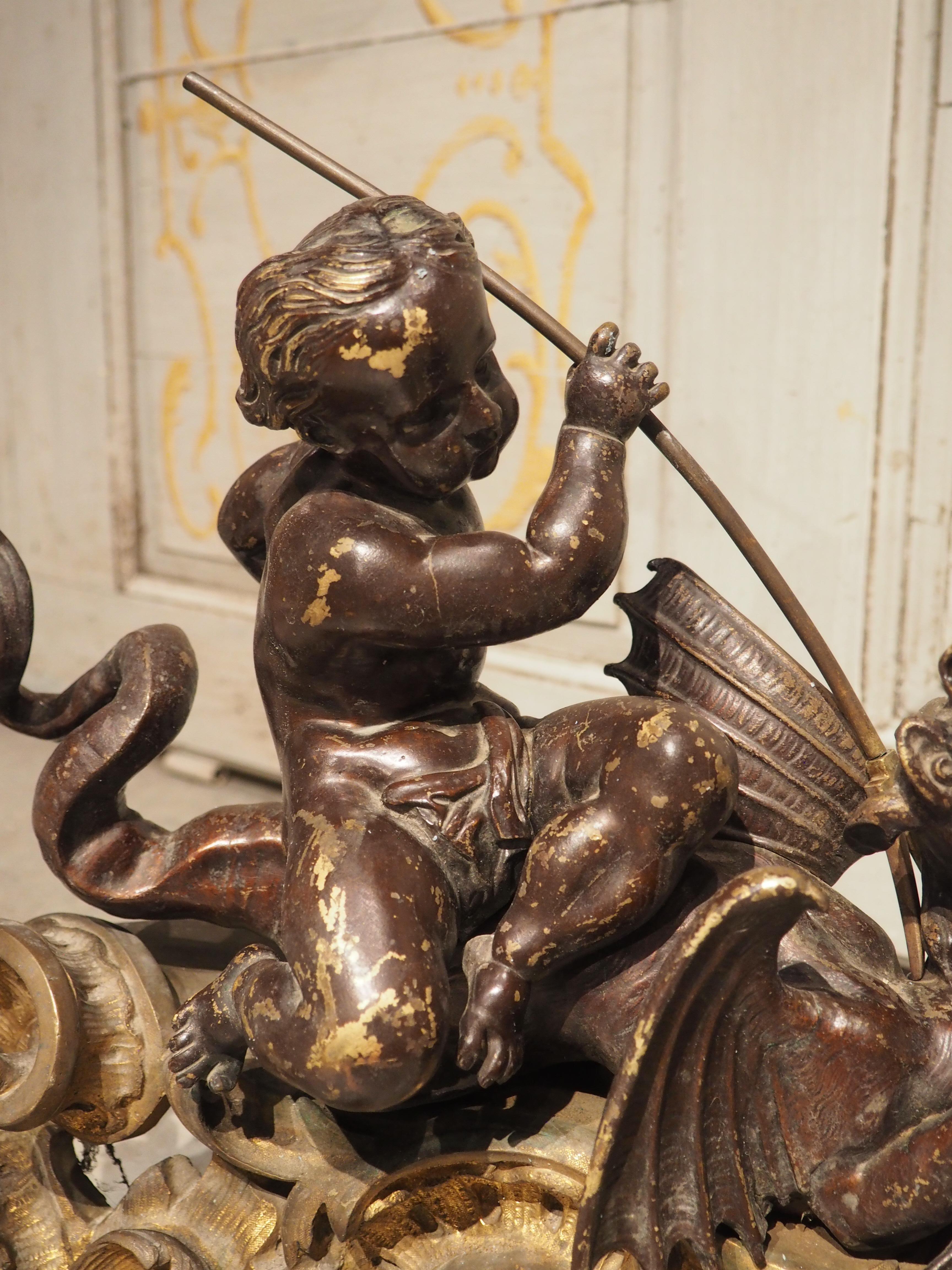 Patinated Impressive Pair of circa 1850 French Bronze Chenets with Putti and Dragons For Sale