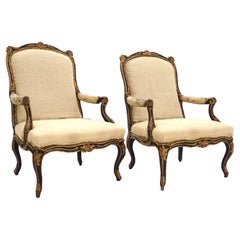 Impressive Pair of French Mid 18th Century Black and Gilt Rococo Armchairs