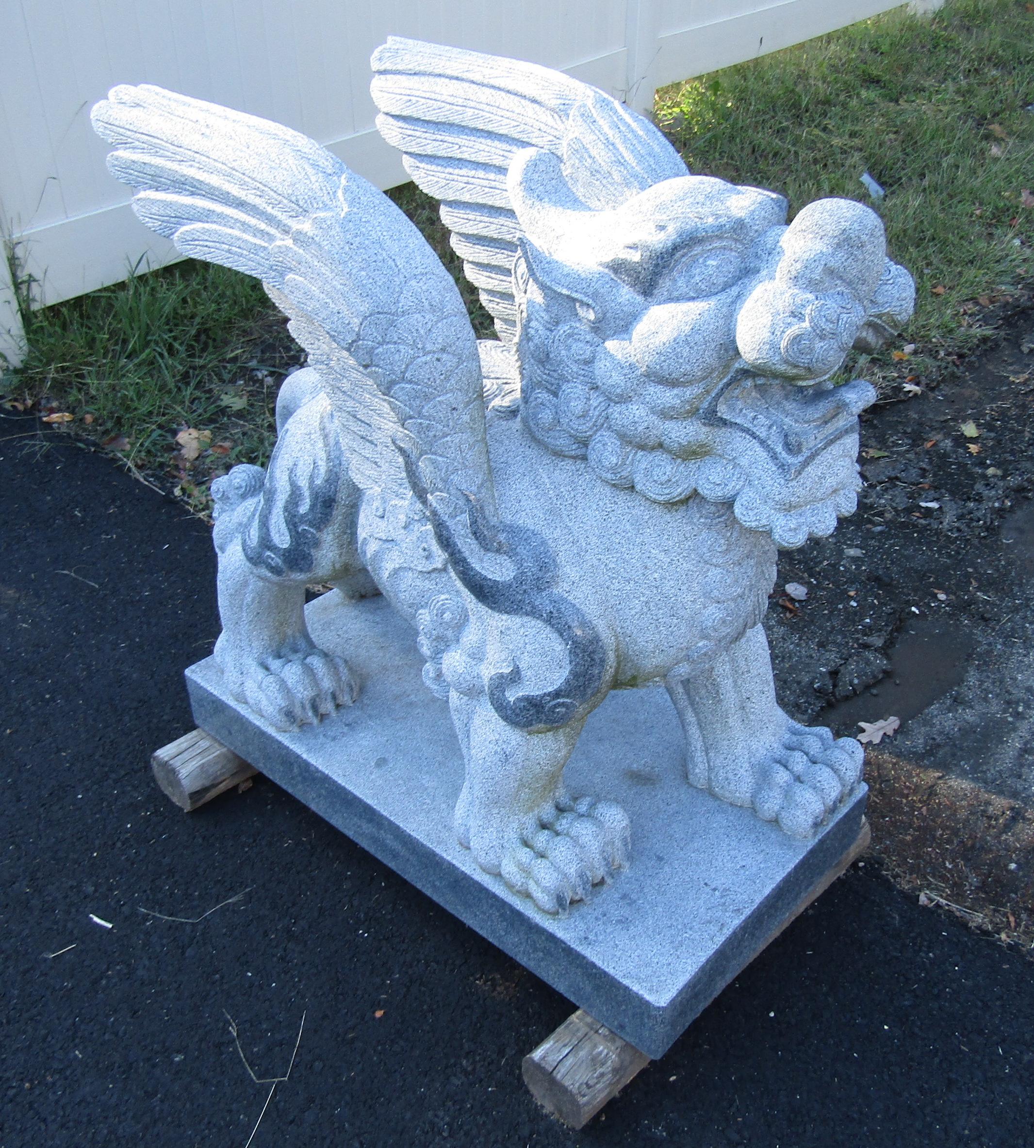 A stunning pair of griffin statues in granite. Well-made with intricate carved detail throughout. These statues look great on each side of the driveway or as a garden decoration. Please confirm item location (NY or NJ).