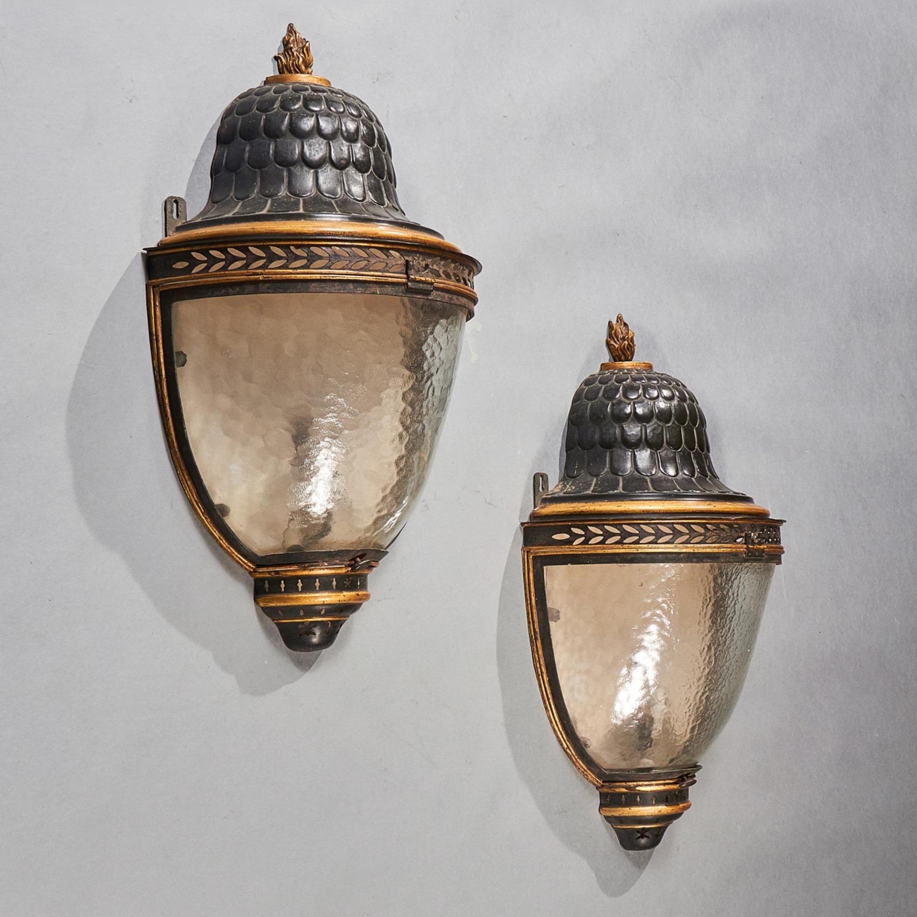 An imposing and fine quality pair of early 19th century French Tole Peinte and parcel gilt wall lanterns with outstanding original finish.



French early 19th century - circa 1820.



These extremely impressive unique wall lanterns of