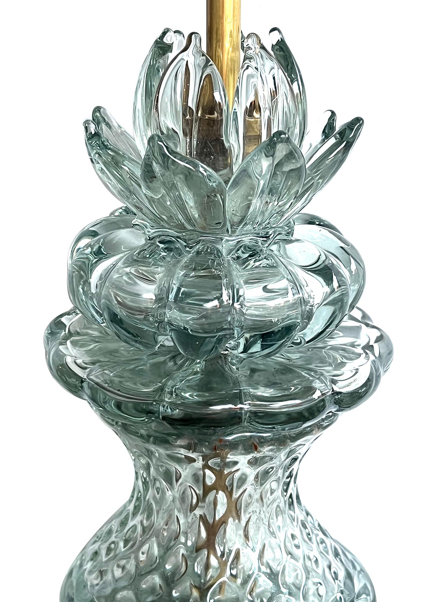 each large and heavy hand-blown lamp with textured surface capped by a splayed crown over a waisted neck and spheroid body; all resting on a custom giltwood base; manufactured in Italy for the Marbro Lighting Company