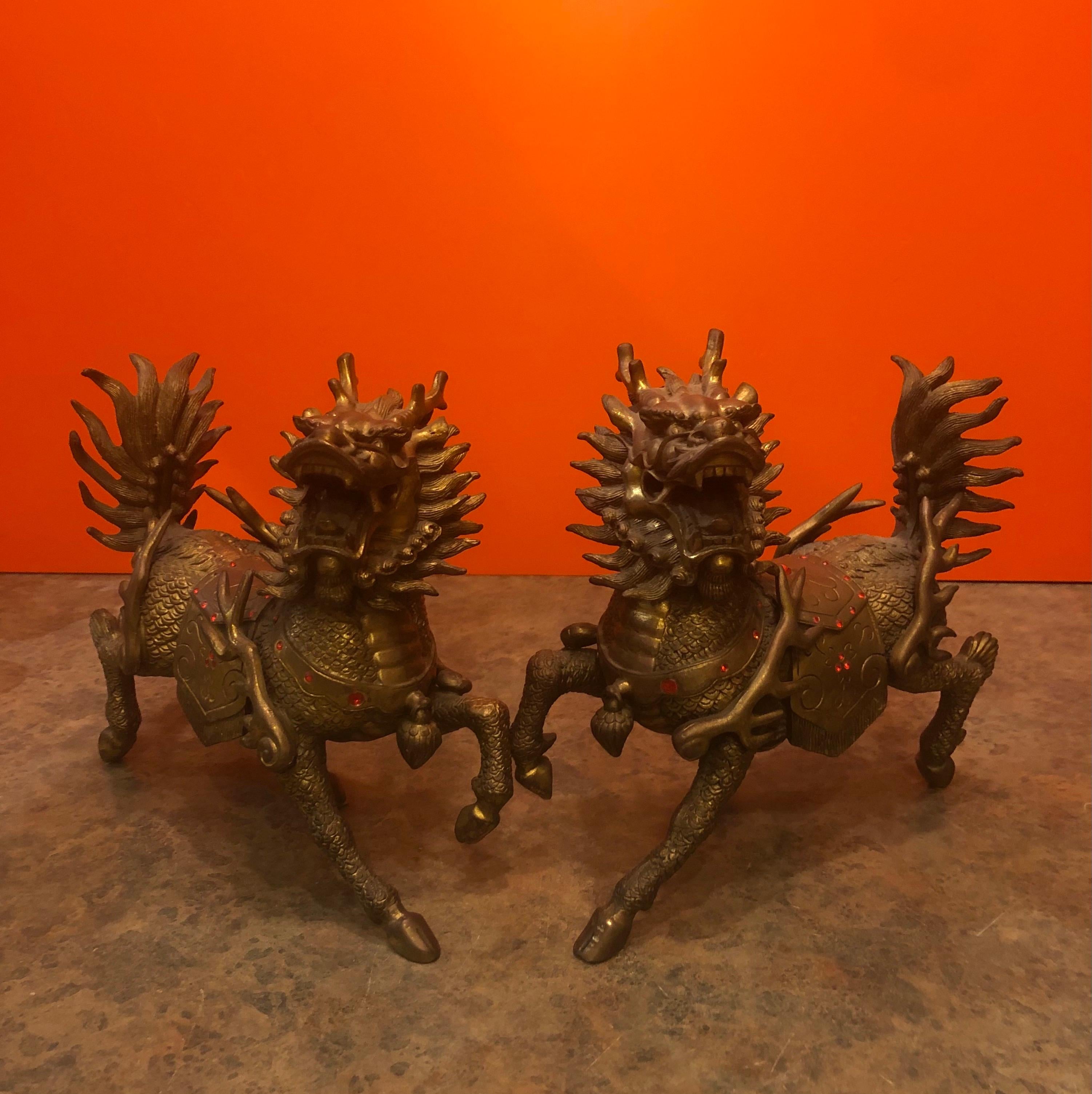 Incredibly unique pair of heavy bronze foo dogs or lions that can be used as decorative accents or bookends. Amazing detail (anatomically correct male and female) and a gorgeous patina. Each foo dog measures: 10