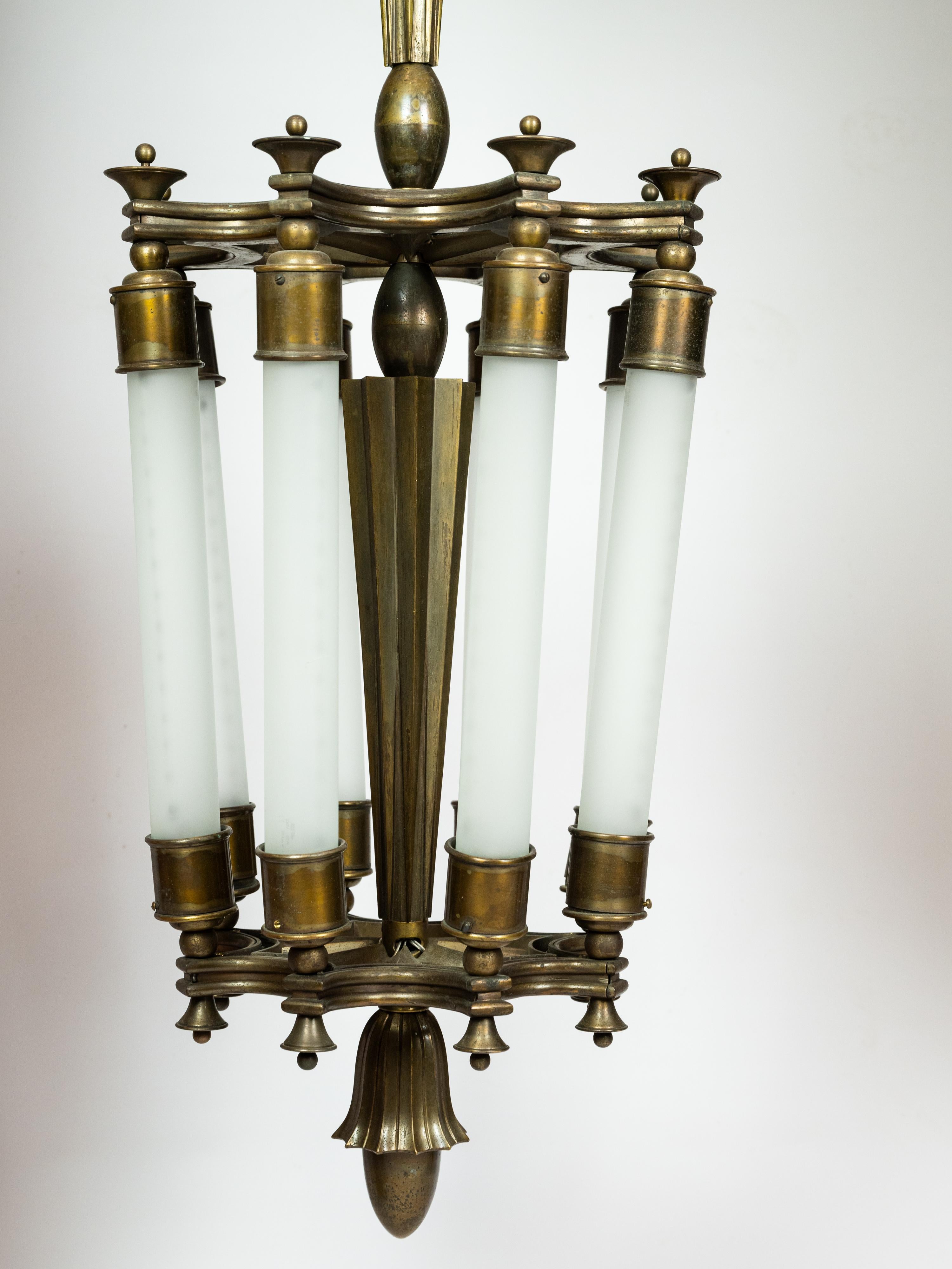 Impression and heavy pendant light in cast bronze designed by Ottavio Cabiati. 

Opaline glass. 

Incredible details and lovely patina. 

Italian production circa 1950. 

D 35 x H 100cm

More information upon request 

