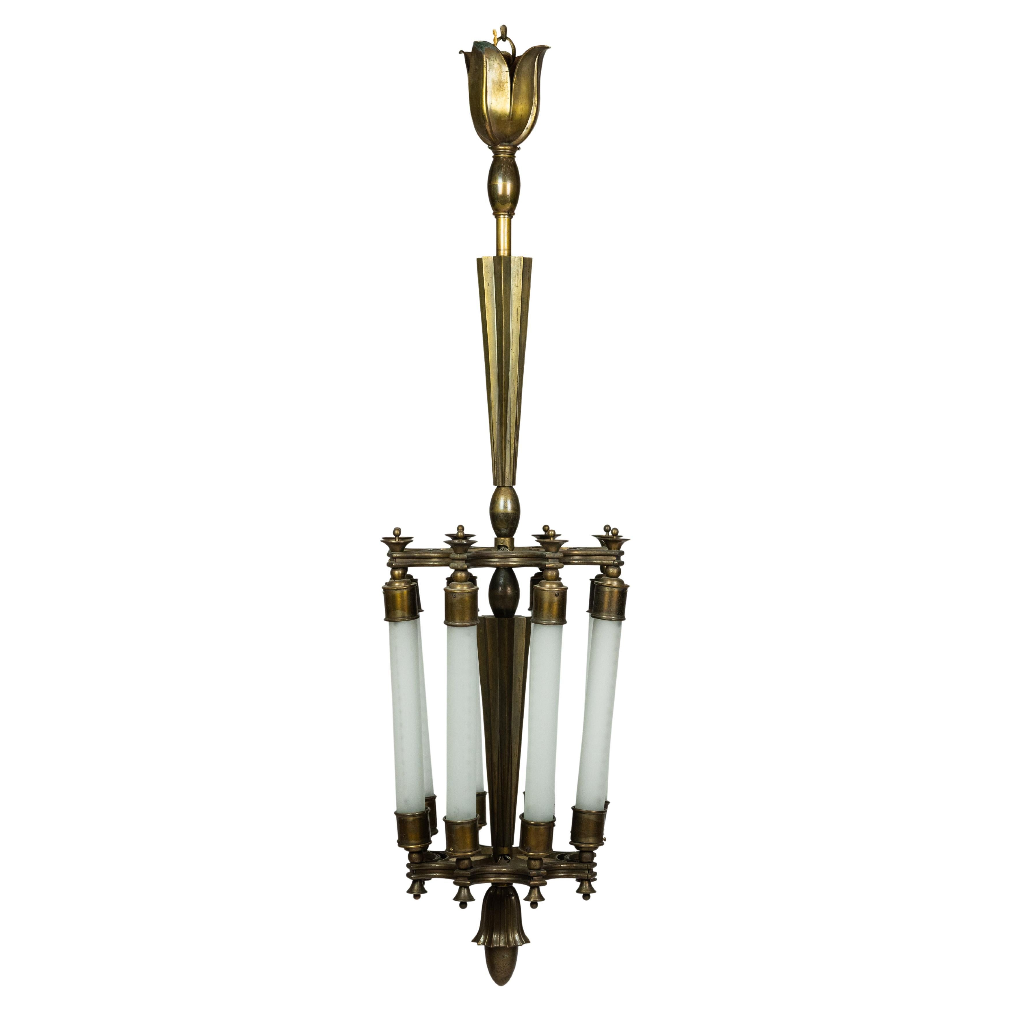 Impressive pendat light in cast bronze designed by Ottavio Cabiati For Sale