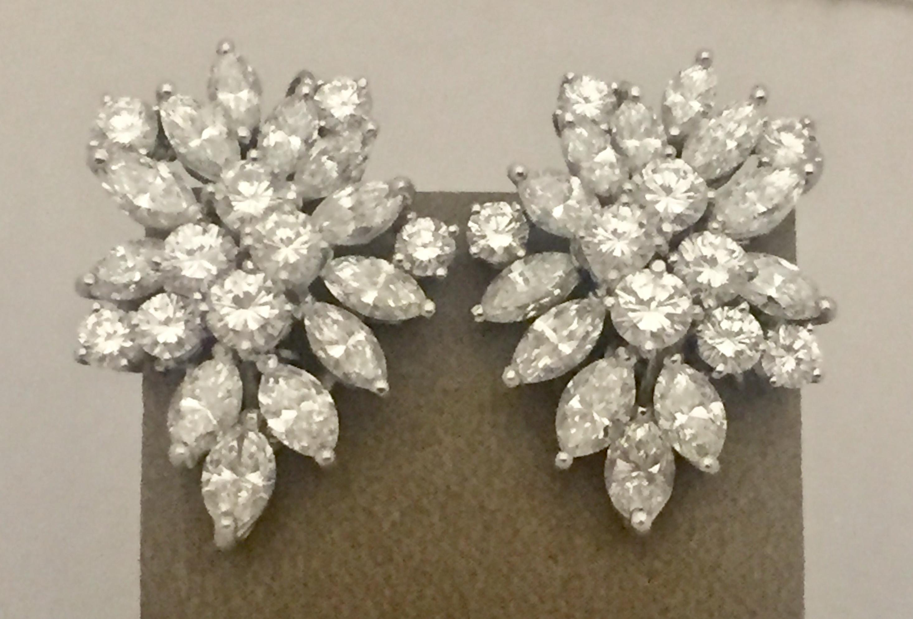 An amazing pair of cluster diamond earclips!  Approximately 11 carats of brilliant cut and marquise cut diamonds set in a timeless design.   Diamonds are F color VS clarity set in Platinum.  Approximately 2.9 cm from the highest to lowest point and