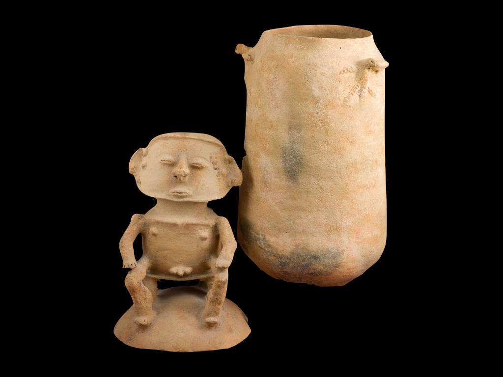 This lidded burial urn is hand-built via the coiling method to hold skeletal remains of a cherished ancestor. It sits with a lightly tapering cylindrical body and mounted with three avian figures in low relief near the rim seated on a three legged