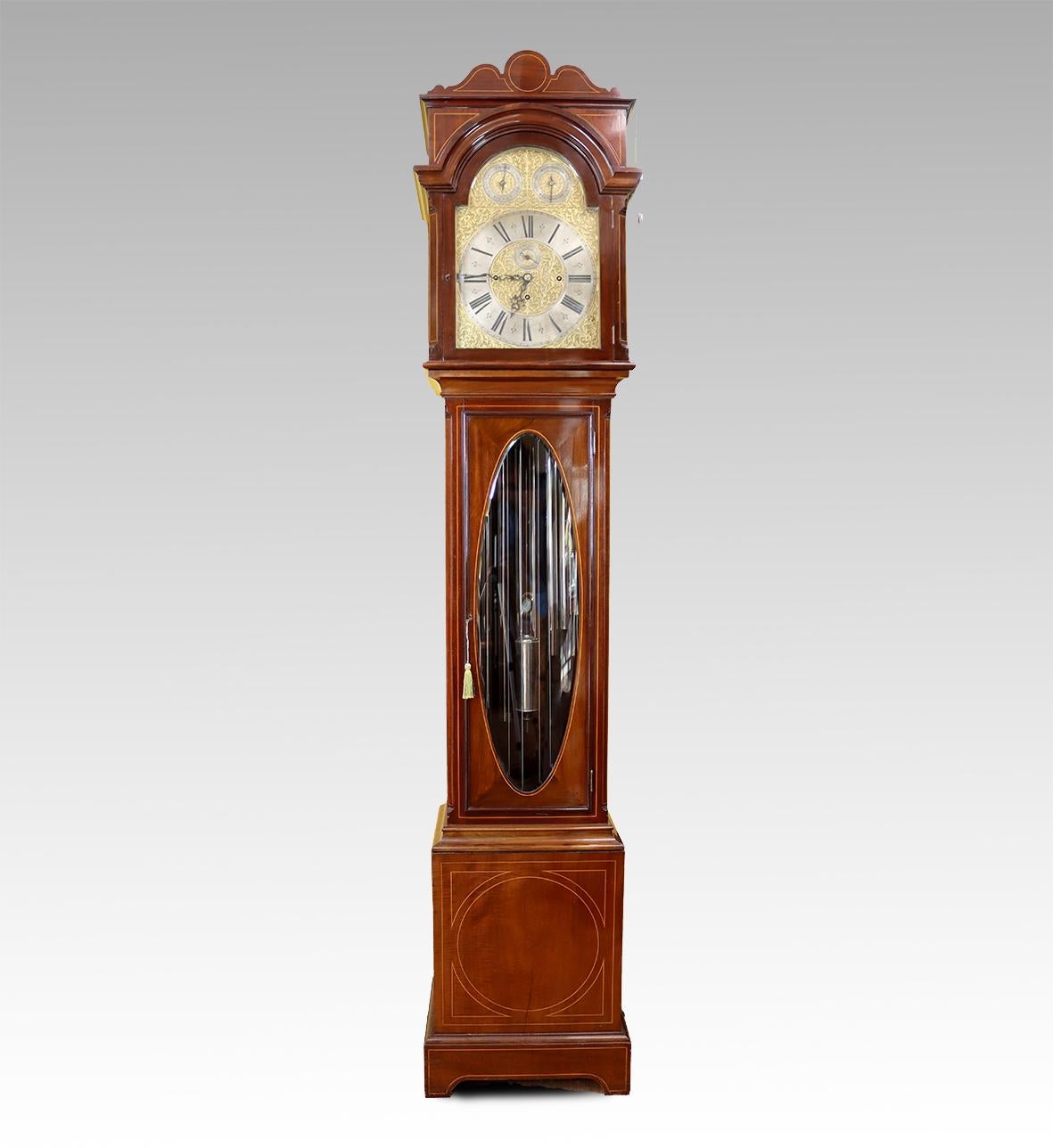A very impressive quarter chiming tubular gong clock with a very high quality three train movement. The movement is of 8 day duration and strikes the quarter hours on eight chrome plated tubular gongs hanging from the rear of the case and the main