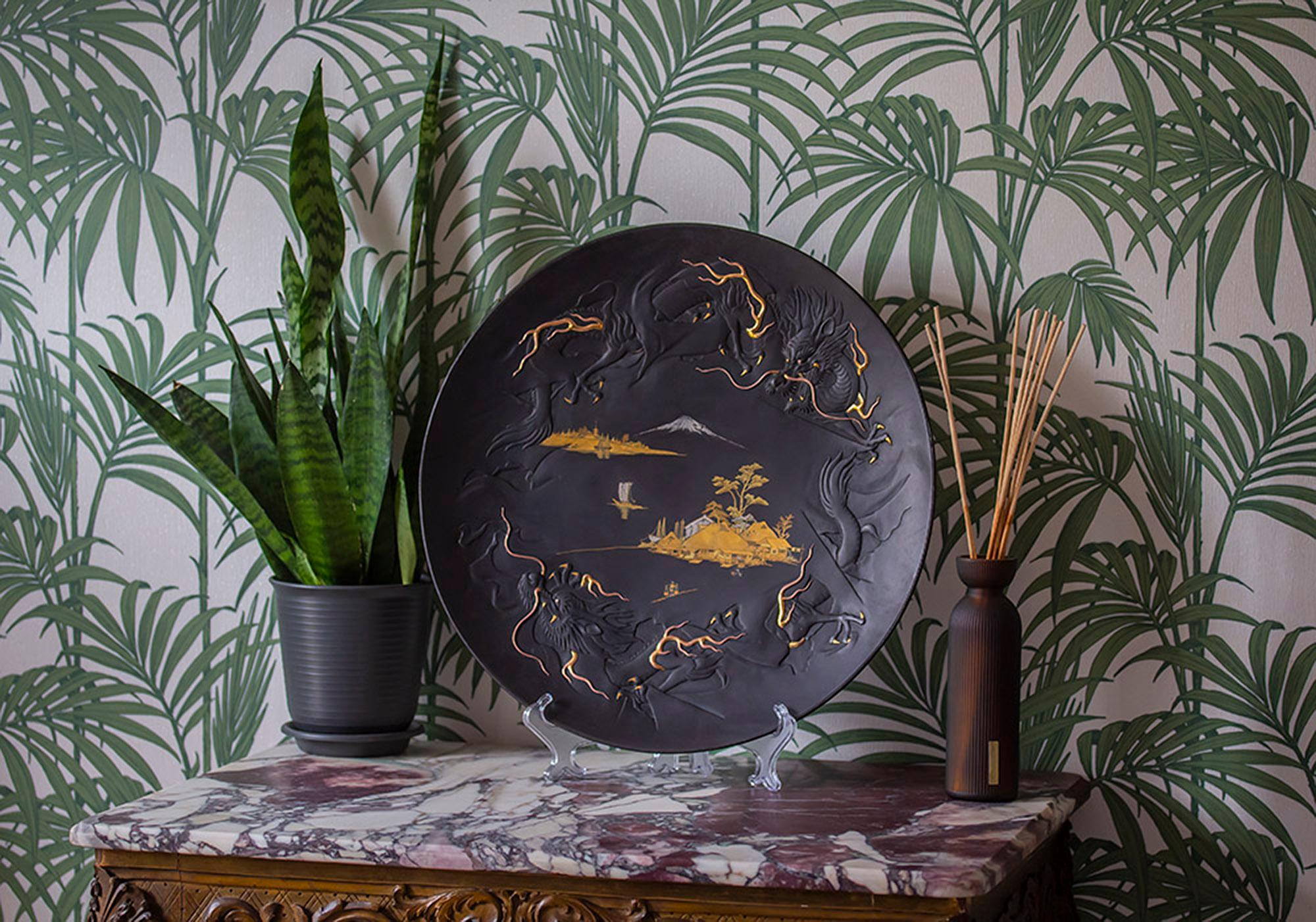 Meiji Period (1868-1912)

From our Japanese collection, we are delighted to introduce this rare and impressive Japanese Komai Iron Charger. The imposing charger decorated with a central scene inlaid with gold depicting thatched roof housing with