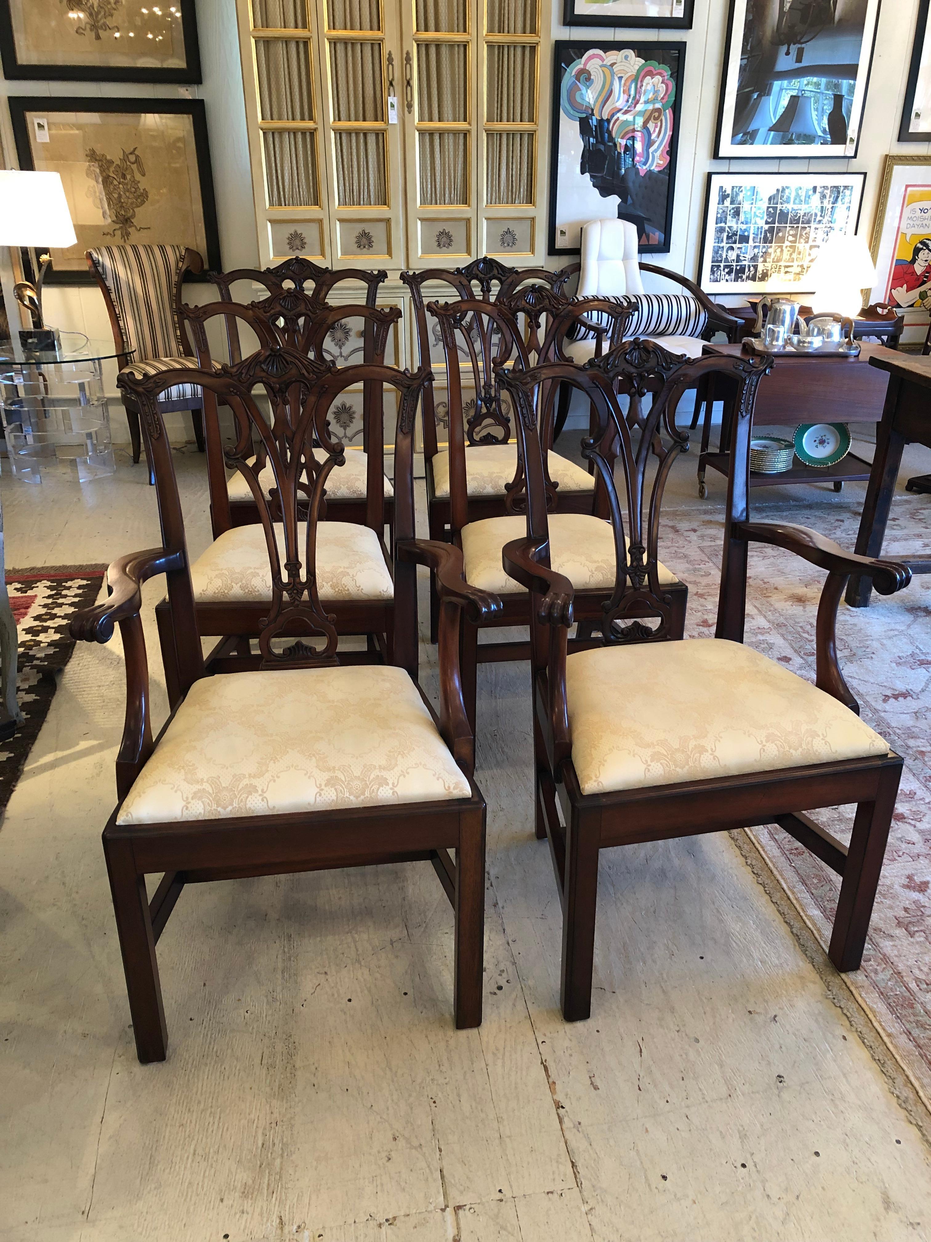 Impressive classic set of carved mahogany Chippendale style dining chairs by Sovereign having two arm chairs and 4 side chairs with rich color wood and elegant light gold creamy seat upholstery.
Side chairs 21 W 19.25 D 40 H seat height 19.5.
Arm