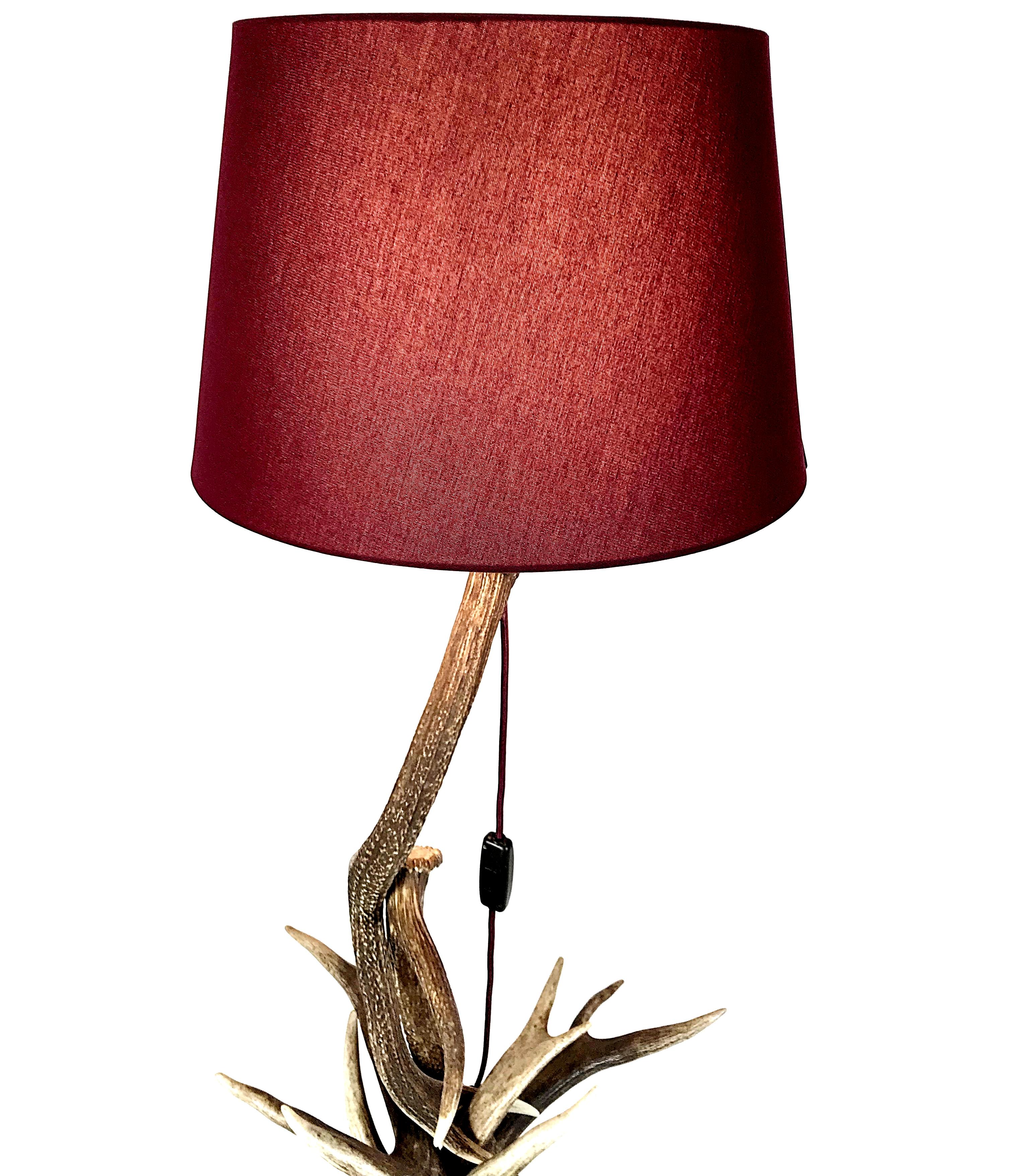 Very impressive deer antler floor lamp handmade in 1940s in Austria. The lamp is made of discarded deer antler. The shade color is Bordeaux like the textile cable with original Bakelite switch. The lamp is in excellent condition. Fully working,