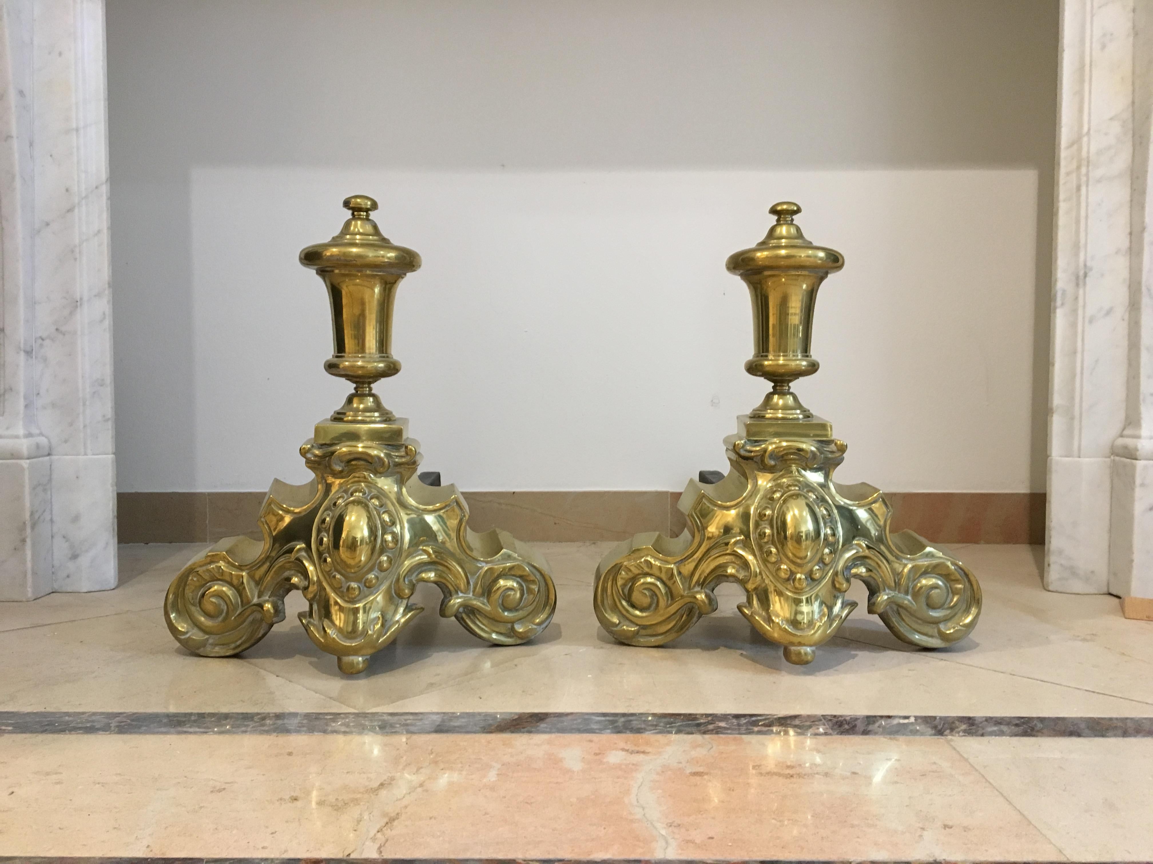 Superb set of 19th century brass andirons.
This impressive French set has deep wrought iron legs and perfect casted and very decorative brass fronts. 

Great original and usable condition, works great in a real log fire.

Sold by Schermerhorn