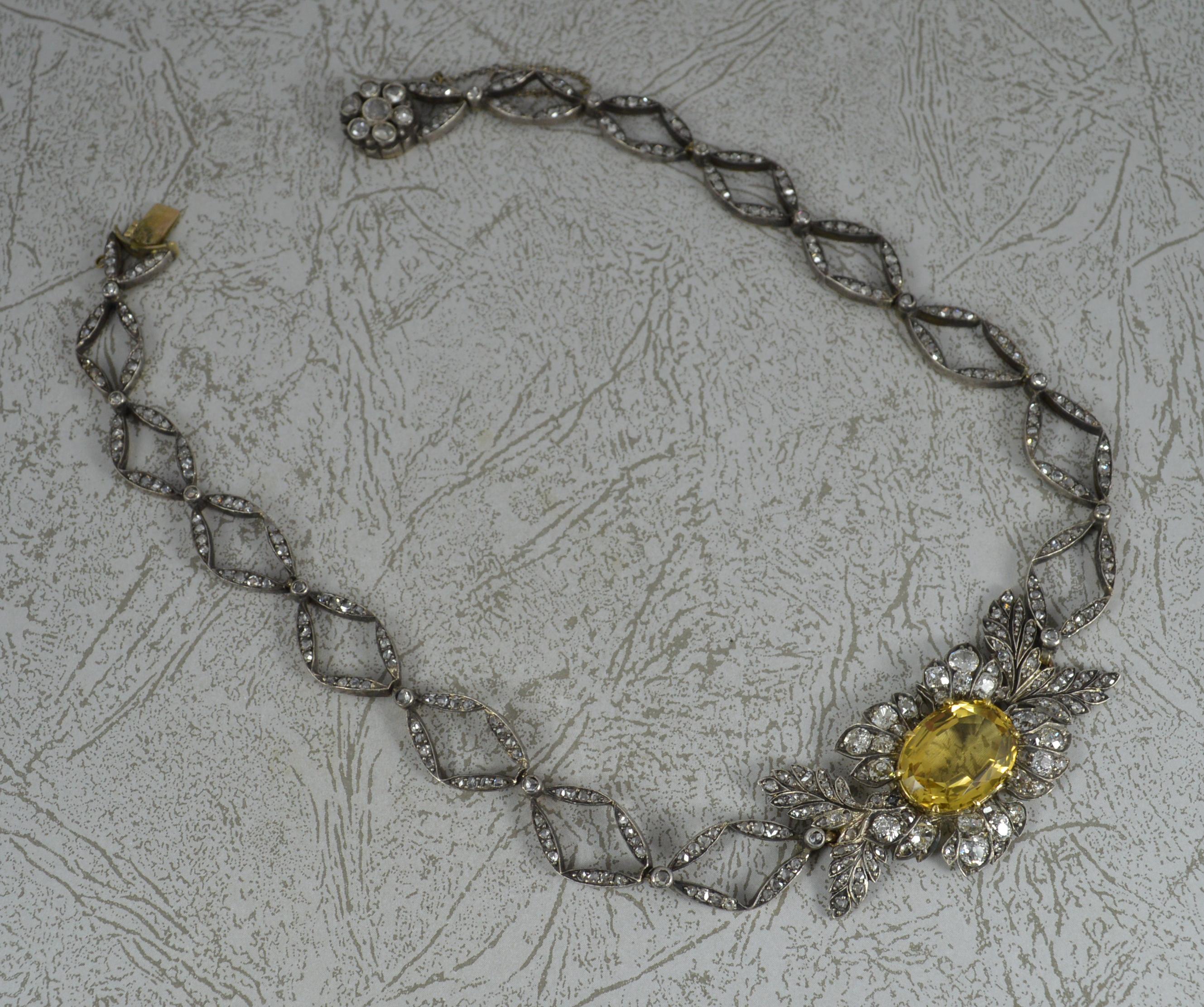 A fantastic mid to late Victorian period necklace chain.
Comprising of many rose cut diamond encrusted links with a rose cut diamond clasp and central cluster set with old European and rose cut diamonds and a large oval cut citrine to centre.
Solid