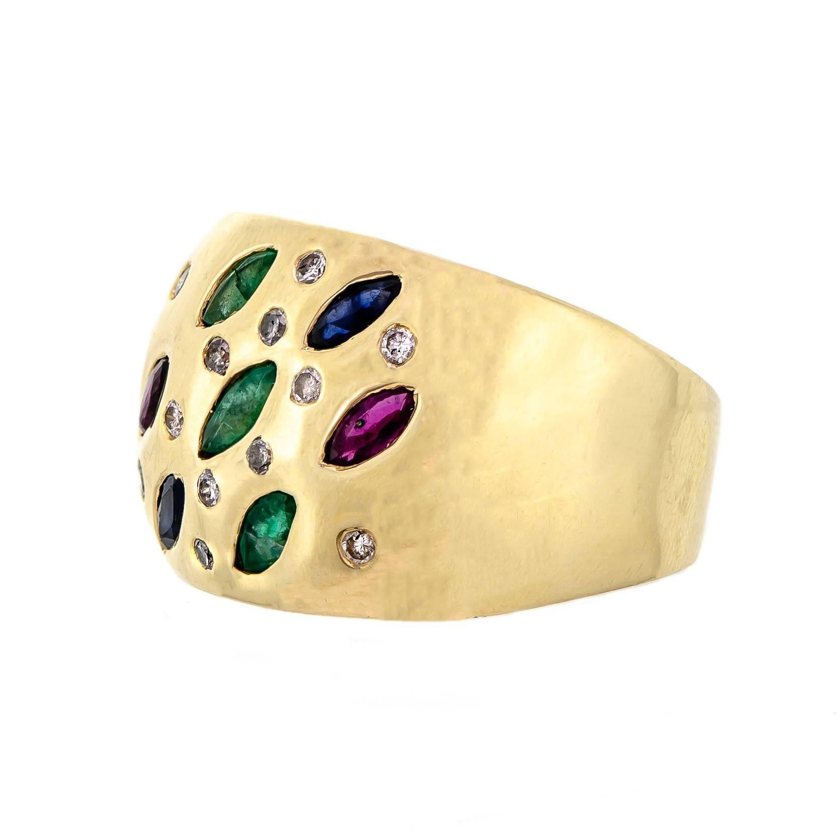 Impressive vintage heavy 14 kt diamond emerald ruby and sapphire cocktail ring. Set with three marquise emeralds, two marquise sapphires, two marquise rubies, and twelve round dazzling brilliant cut diamonds. Crafted into a heavy 14k yellow gold