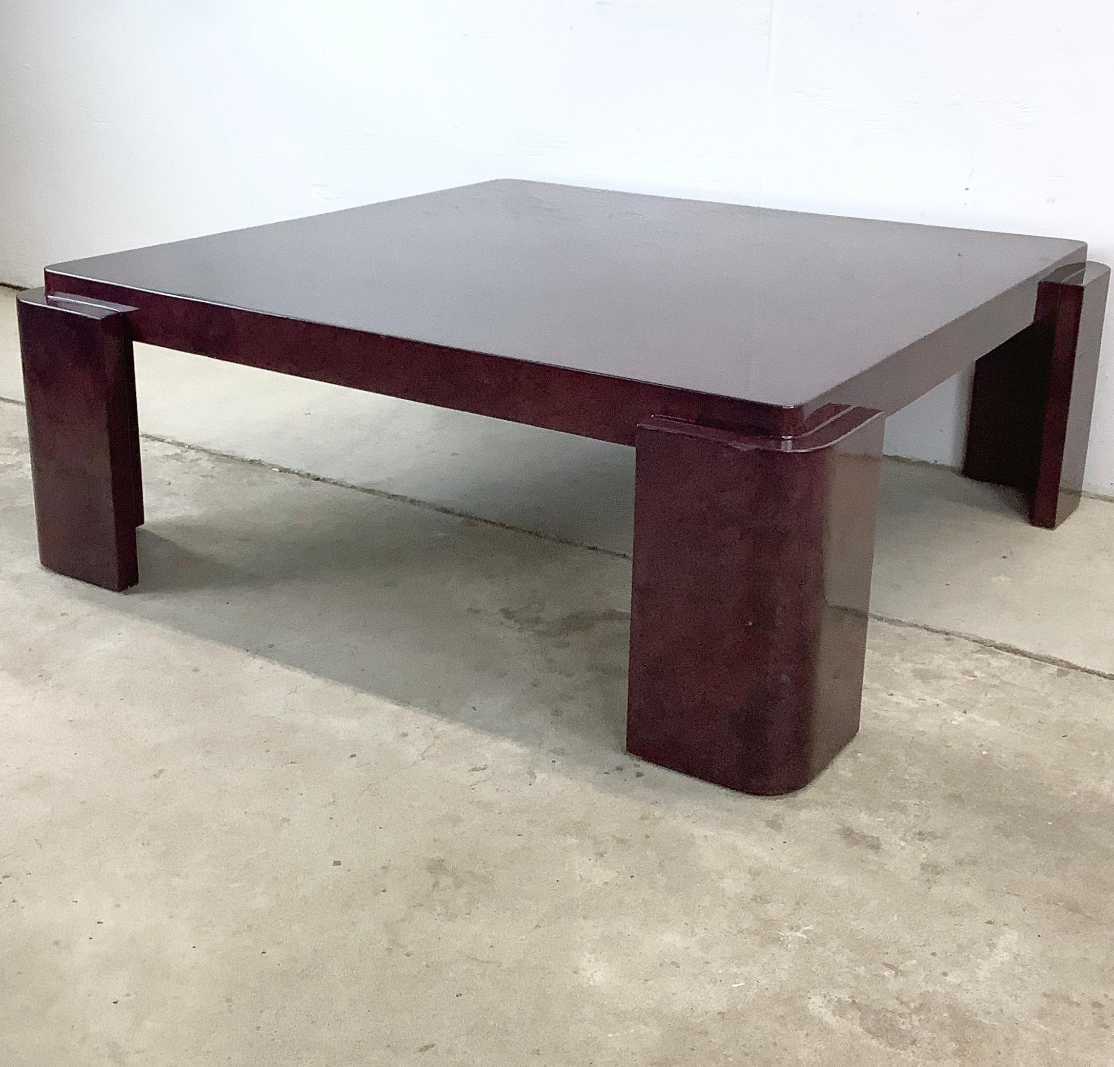 This showstopping oversized square coffee table is a true gem in the world of vintage modern furniture. Adorned with a luxurious purple lacquer finish, is a perfect fit for spacious interiors in need of a center table that brings with it the