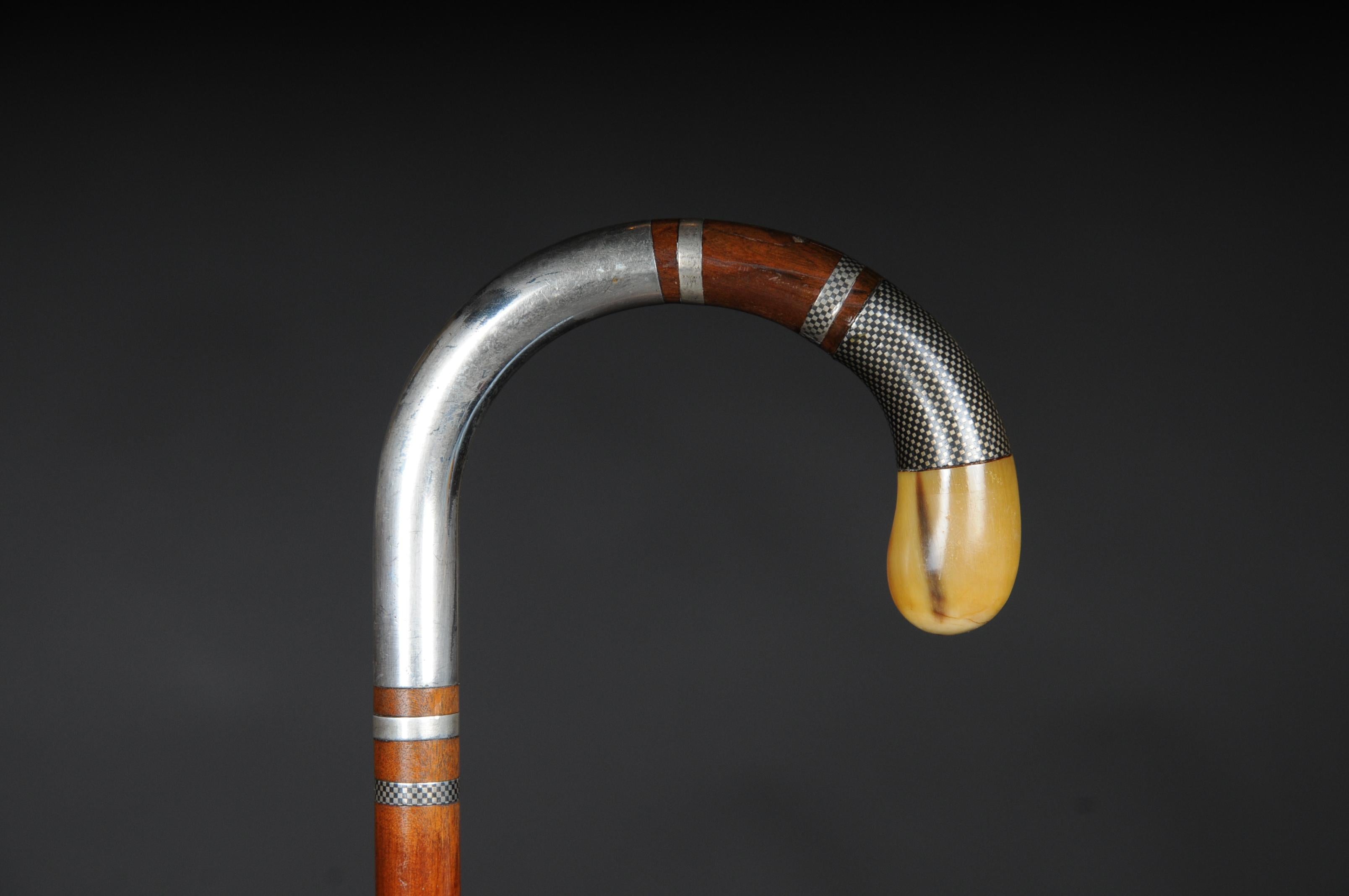 Impressive walking stick / strolling stick 835 silver, pearwood

Solid pearwood with 835 crescent moon and silver mount crown, circa 19th century. The spout at the end of the stick is also made of 835 silver. The handle end is finished with Horn.