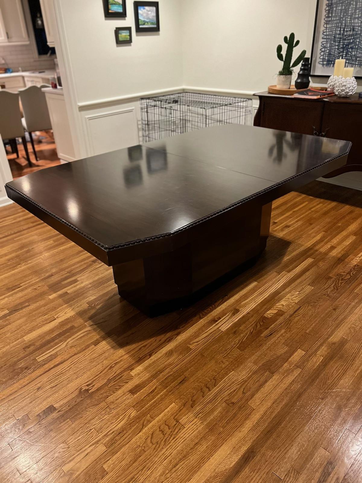 Stunning dining table made by E J Victor for Ralph Lauren in a dark solid wood walnut veneer with sculptured plinth base. Comes with two leaves that measure 20 inches each so when fully extended table is 9 ft. (108