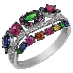 Impressionnante bague en or blanc avec saphir jaune, bleu, rubis, tsavorite et diamant