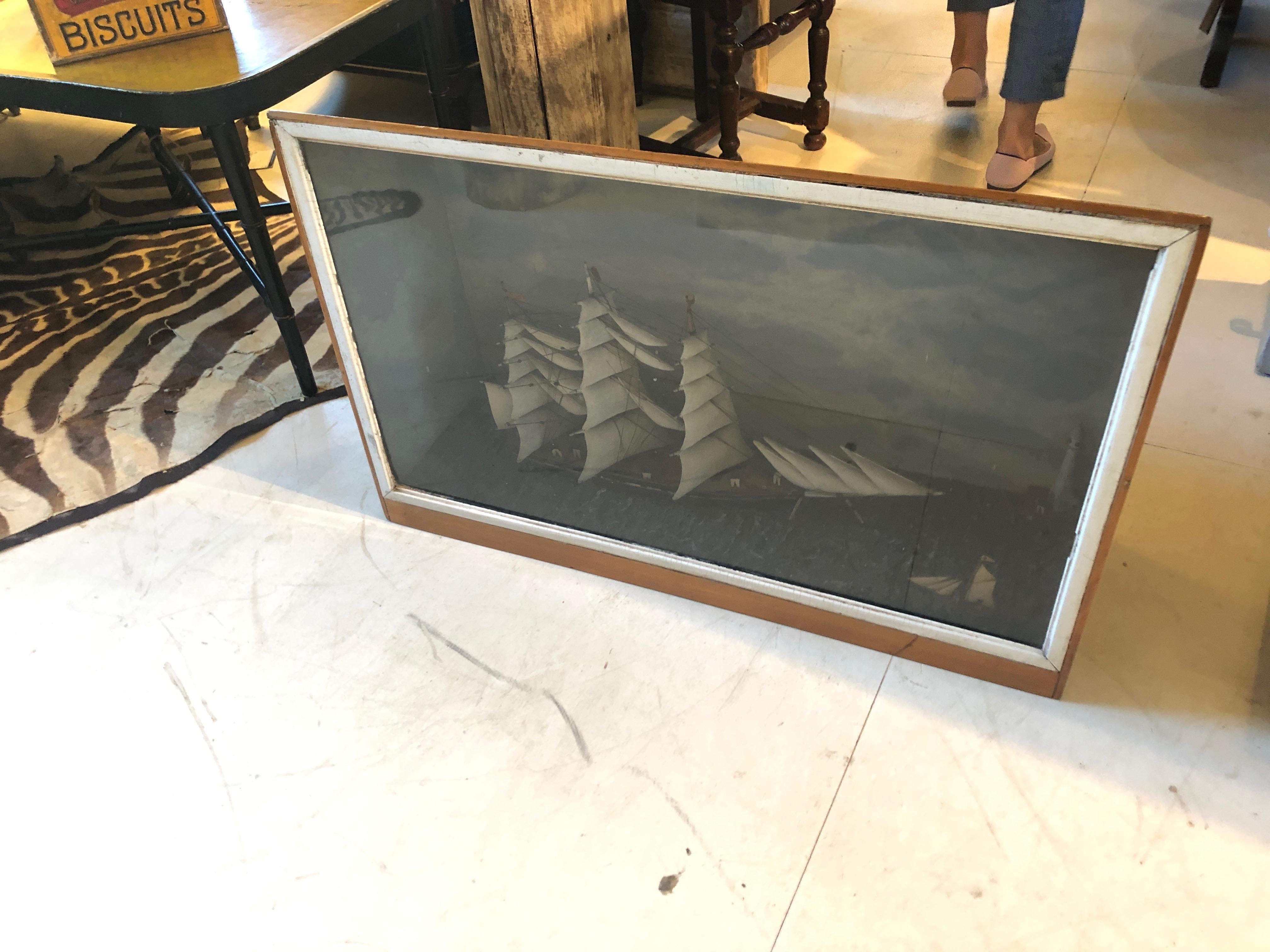 A very large impressive diorama or shadow box work of art with detailed sailing vessel.