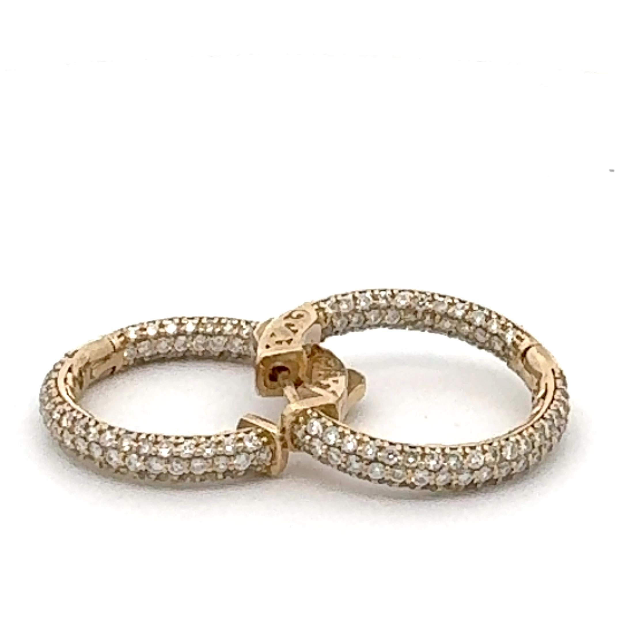 The hoop earring is circular, encircling the earlobe, and it features diamonds set completely around the hoop, yellow gold diamond hoop earring typically combines the richness of yellow gold with the brilliance of diamonds to create a luxurious and