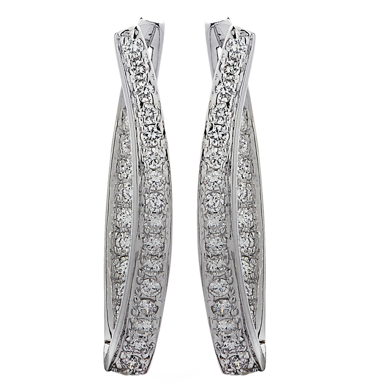 Stunning in and out diamond hoop earrings crafted in white gold, featuring 50 round brilliant cut diamonds weighing approximately 1 carat total G color, VS-SI clarity. Each diamond is carefully selected, perfectly matched and set on the inside and