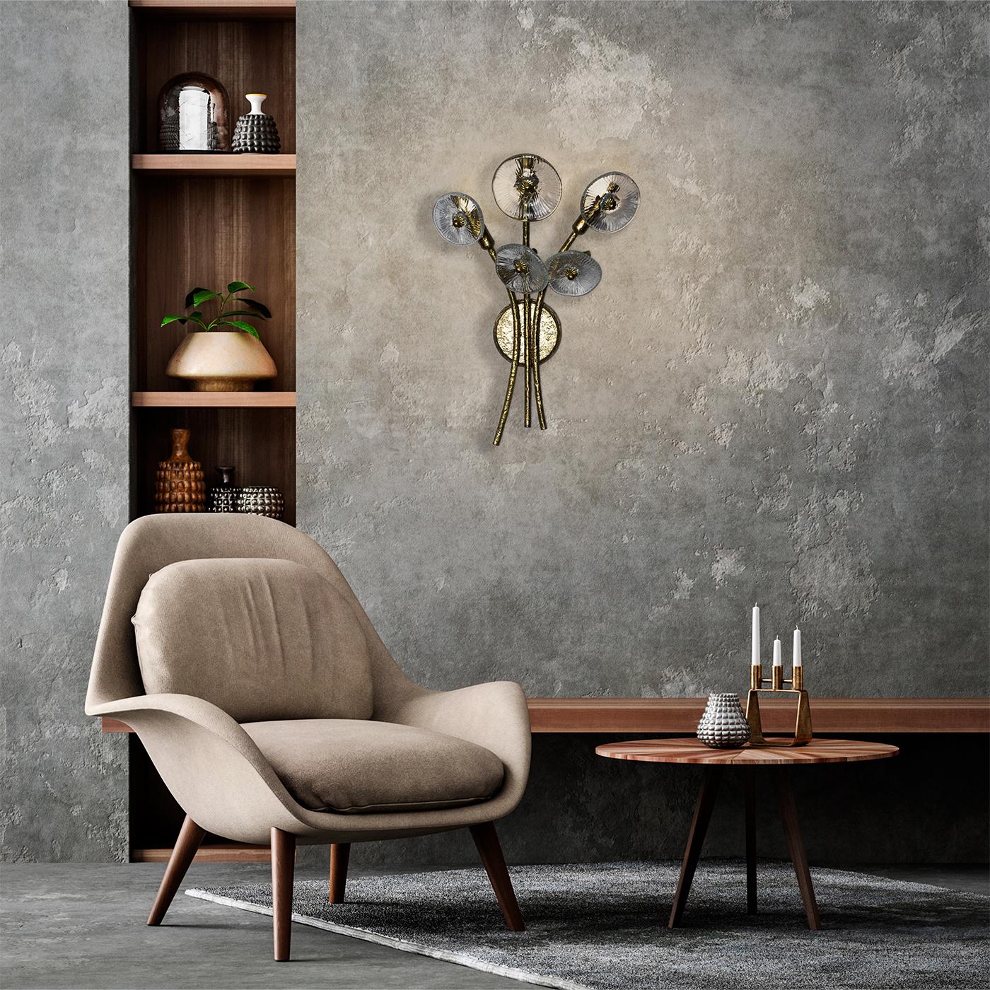 A celebration of nature and craftsmanship, this refined wall lamp draws inspiration from a bundle of blossoming flowers. Minutely mouth-blown, the bud-like glass shades top elegant curved arms in hammered brass that recreate graceful stems. Please